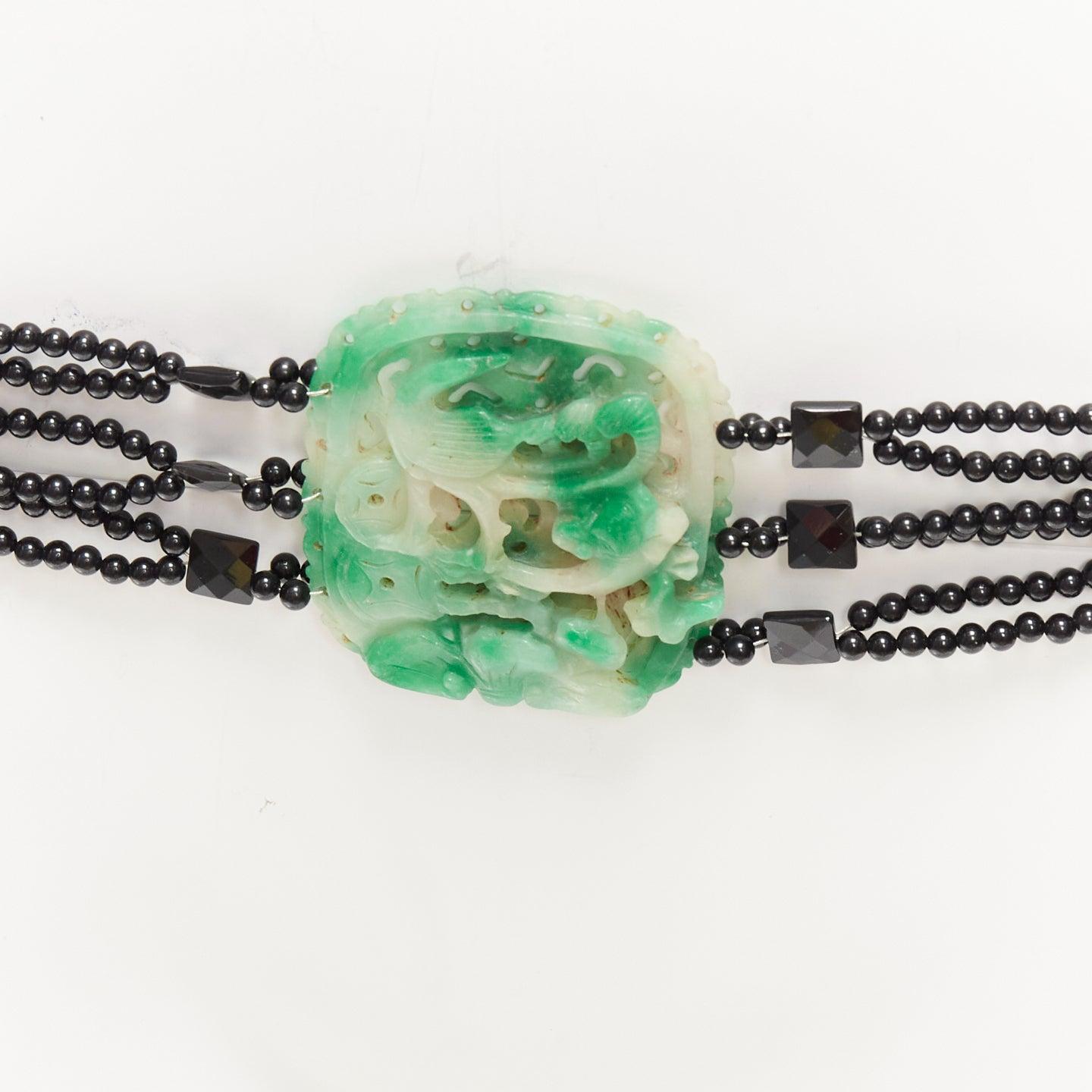 JENNIFER POLLOCK green oriental chinese stamp jade black beads chain belt
Reference: AAWC/A01198
Brand: Jennifer Pollock
Color: Green, Black
Pattern: Ethnic
Closure: Lobster Clasp
Lining: Black
Extra Details: Chinese style stamp