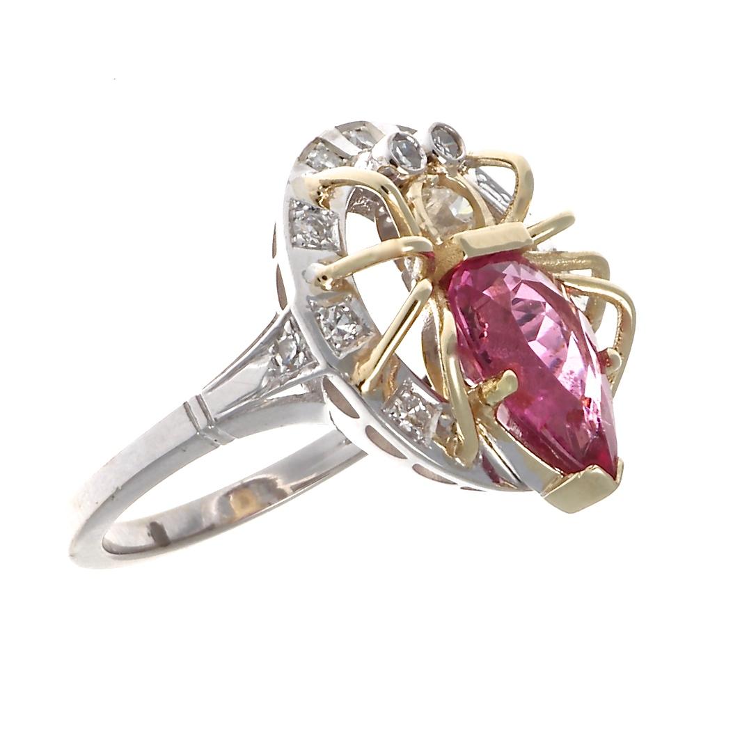 With eight legs representing the infinite, the spider symbolizes divine feminine energy and our creative ability to weave dreams into reality. A lush faceted pink tourmaline is surrounded by 14k yellow gold legs and sits atop 14k palladium. This