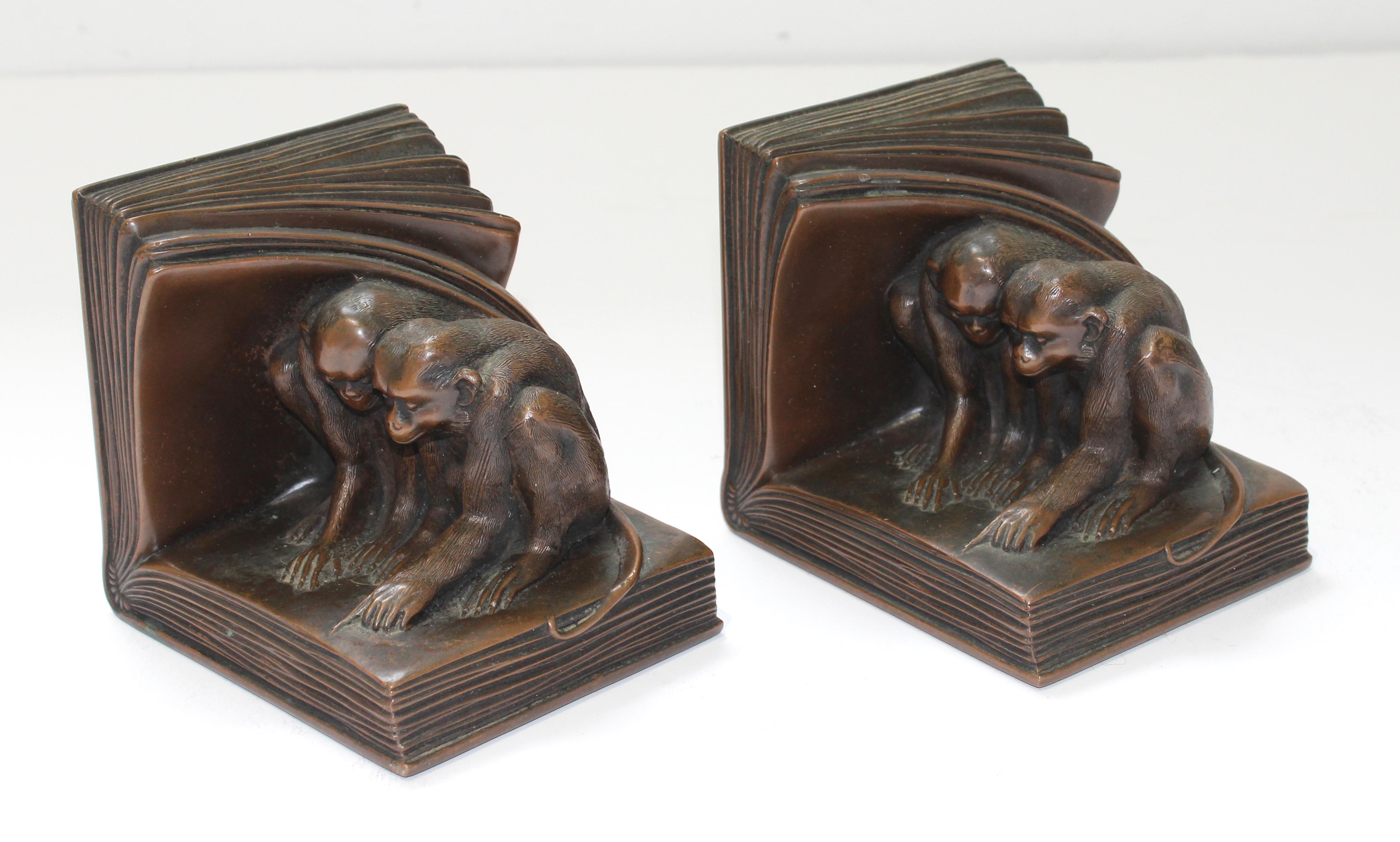 Vintage 1920s Jennings Brothers Bookends Art Deco Bronze Monkey Motif - the Pair - from a Palm Beach estate.

Charming Rare Jennings Brothers bookends featuring 2 monkeys sitting inside pages of an open book. One with eyes wide opened and a bit of