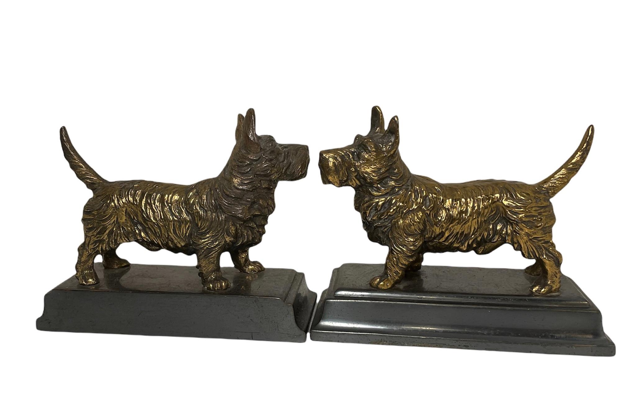 A pair of dogs bookends that stands out by the details in its making. Jennings Brothers was a metalware company in Bridgeport, Connecticut from 1890-1953. They were very well known for their high quality metalware objects (trinket boxes, frames,