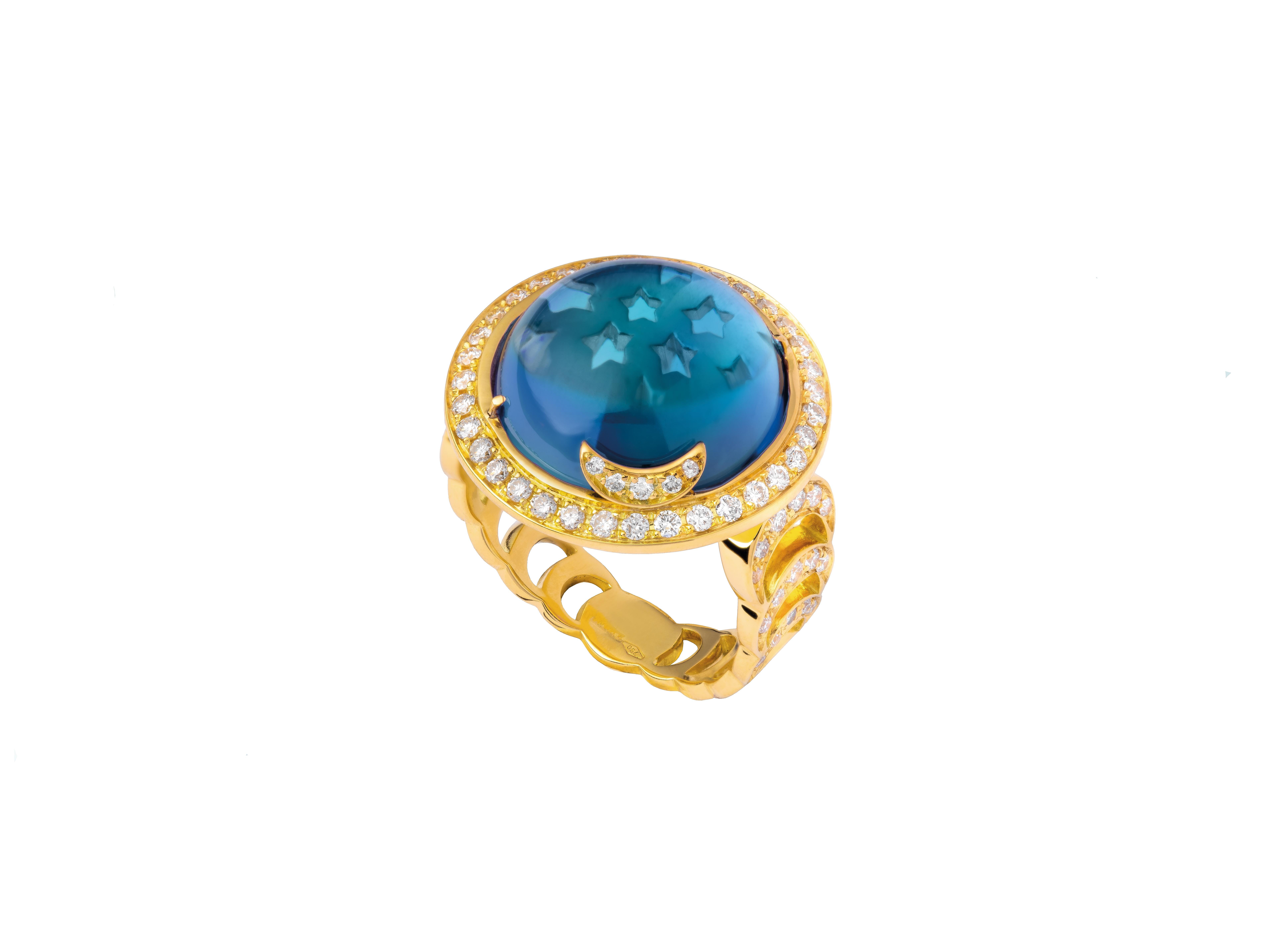 Andromeda ring

18kt yellow gold, 13.60 ct Blue Topaz round cabochon, 0.89 ct White Diamonds, 9.00 gr total gold.

The « Andromeda » ring is a magical constellation. The band is paved with diamonds or sapphires and represents the moon phases, ending