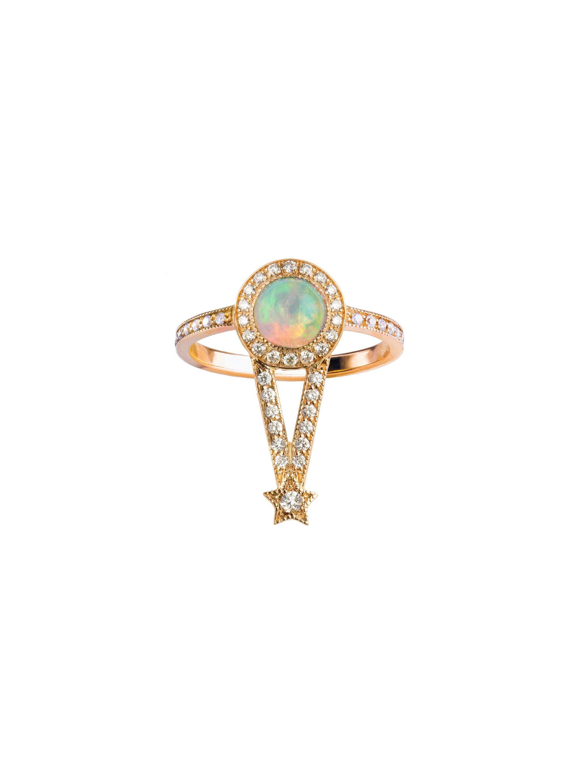 The Maia Ring

18kt rose gold, 0.70 ct Ethiopian Opal round cabochon, 0.31 ct White Diamonds, 0.02 ct White Diamond, 3.75 gr total gold. 
This magical ring has a wow effect and can be worn alone or stacked with any of our rings from the Pleiadee