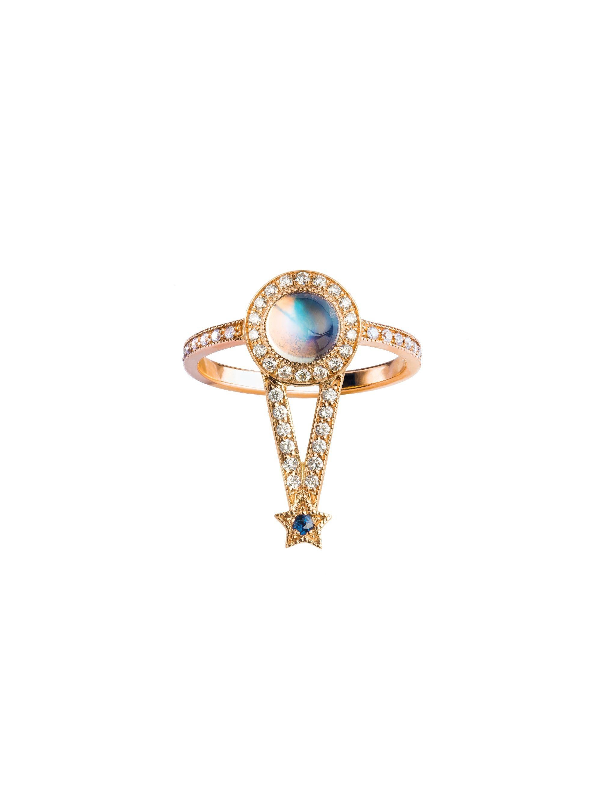 Maia Ring

18kt rose gold, 0.97 ct Rainbow Moonstone round cabochon, 0.30 ct White Diamonds, 0.02 ct Blue Sapphire, 3.75 gr total gold. 
This magical ring has a wow effect and can be worn alone or stacked with any of our rings from the Pleiadee