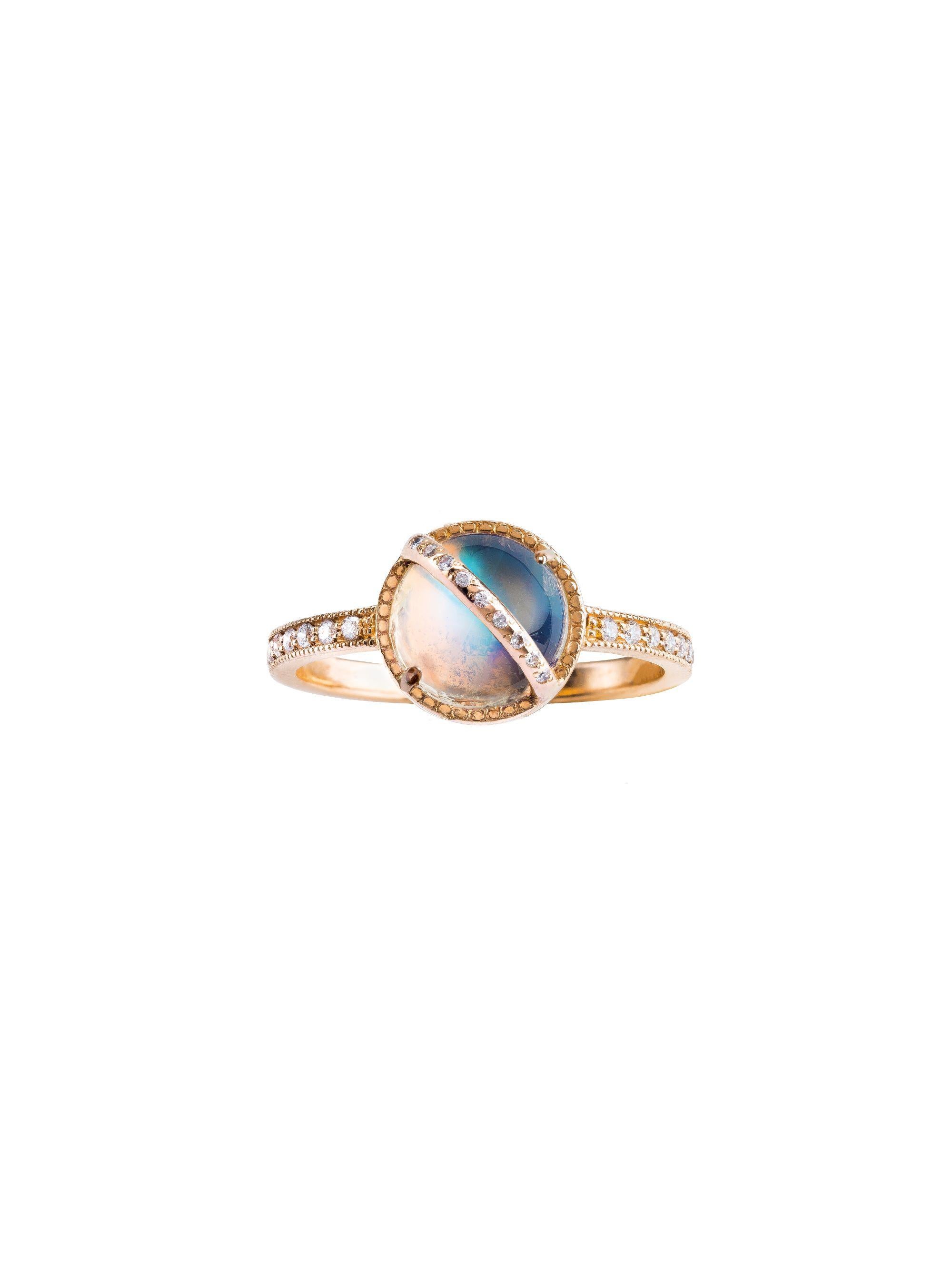 Taygeta Ring 

18kt rose gold, 1.90 ct Rainbow Moonstone round cabochon, 0.15 ct White Diamonds, 2.90 gr total gold.
This magical piece is exquisite on its own, or can be mixed and stacked with an Electra or Celaeno ring for a total cosmic