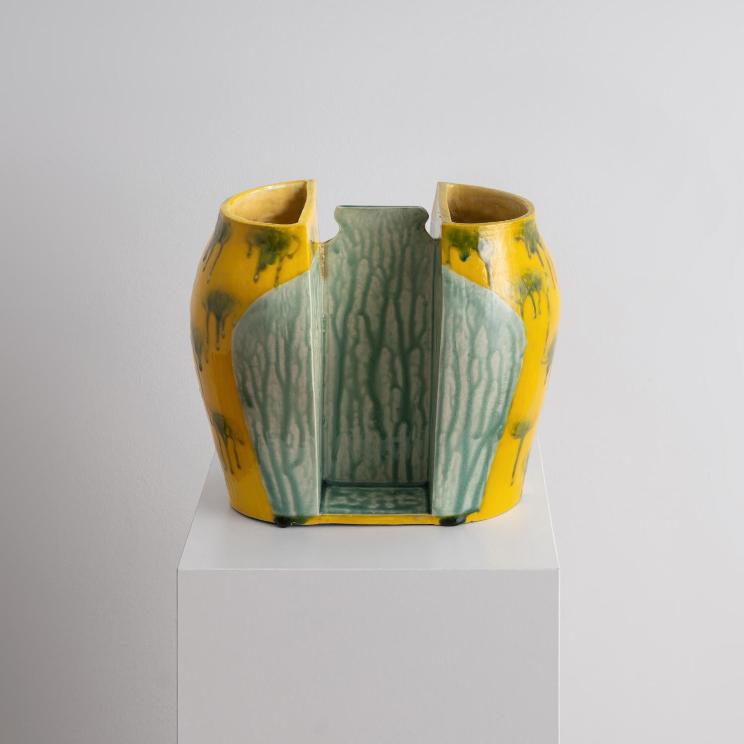 Vibrant, contemporary ceramic sculpture by Los Angeles-based artist and curator Jenny Hata Blumenfield. A gorgeous vessel that is an energetic accent to any room.

A vibrant, sunny yellow glaze provides a background for drippy bursts of matcha