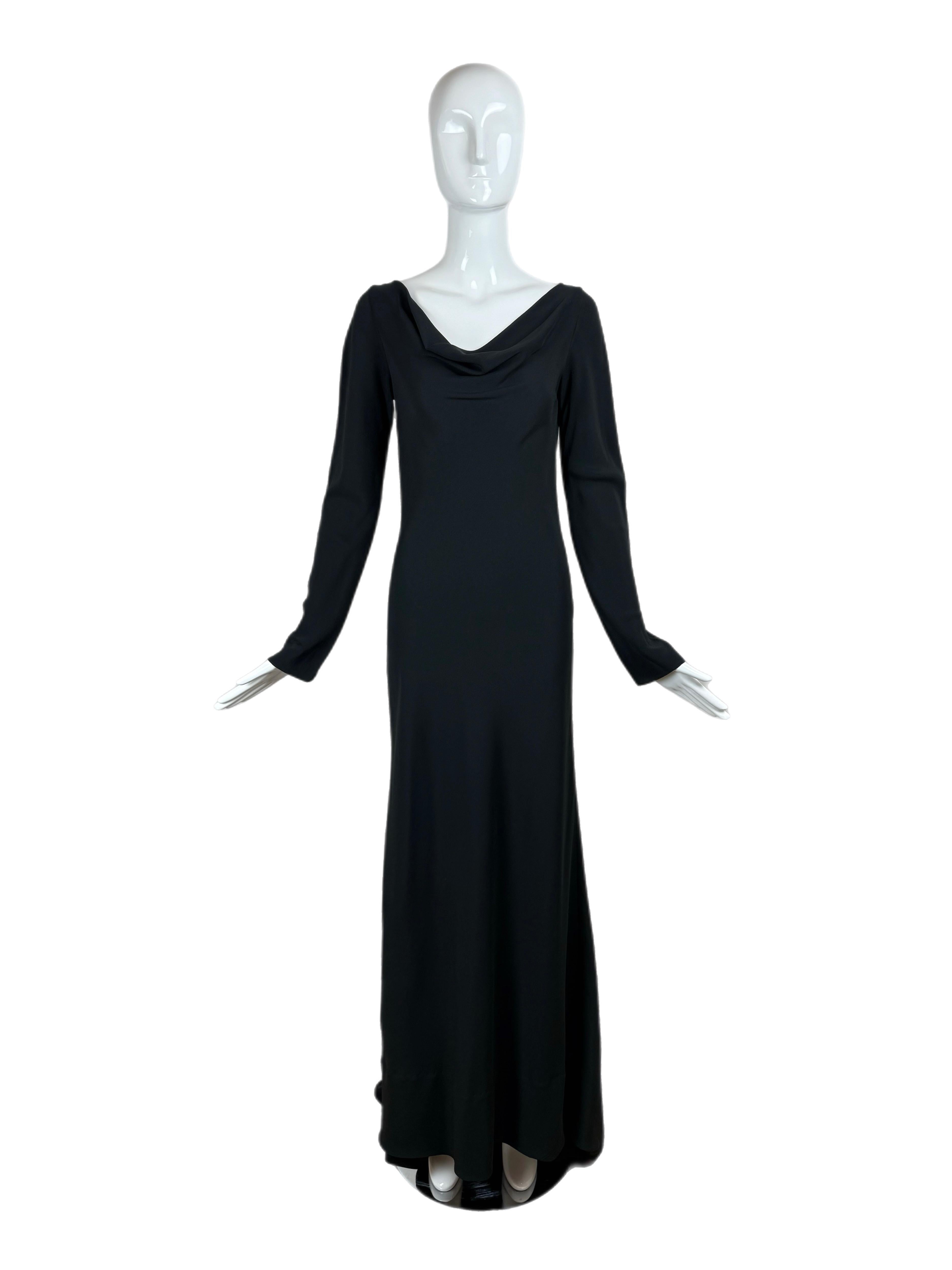 Jenny Packham
'90s
Vintage
Negro azabache opaco
Mangas largas
Falta la talla y la etiqueta comp, pero sin duda es de seda
Cuello redondo
Lazo ajustable en la espalda
Estilo jersey
Medio tulipán de terciopelo al final de cada lazo
Excelente estado,