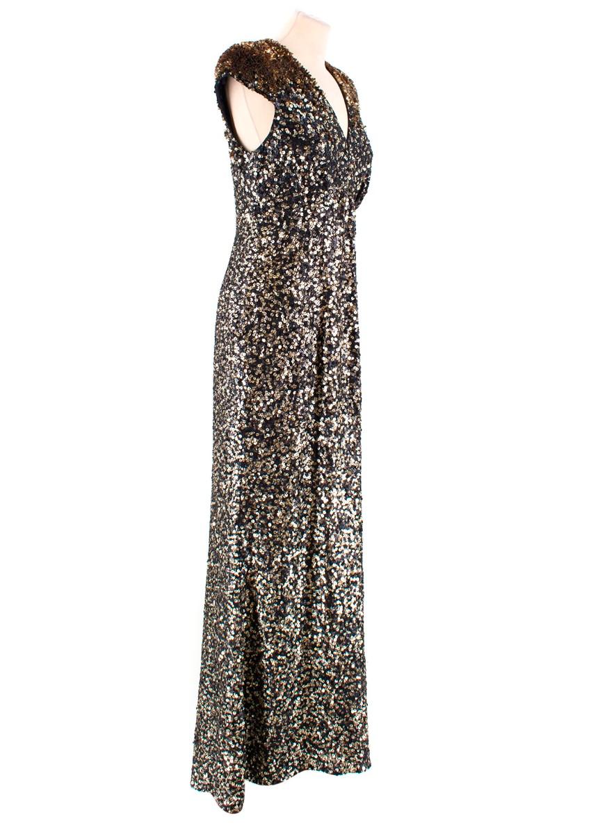 Jenny Packham Black & Gold Sequinned Silk Gown

- Floor length gown
- Capped sleeves
- Padded shoulders
- Concealed rear fastening
- V -neck 
- Column silhouette
- Floor-sweeping hem
- Black silk shell completely embellished in gold and black