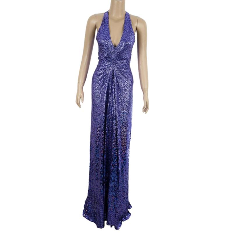 Part of the Fall/Winter 2010 collection, this Jenny Packham dress is an embellished paradise. Its colorful exterior is decorated with pearlescent sequins in shades of blue and purple. The waist is accentuated with the ruching at the bust, combined