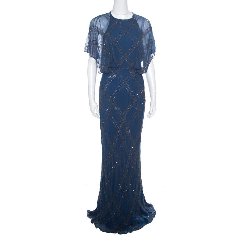 Beautifully embellished with crystals and beads creating an elegant embroidery all over, this breathtaking gown from Jenny Packham is ideal for special events. The floor-grazing length and gorgeous blue color combine to make it as sophisticated as