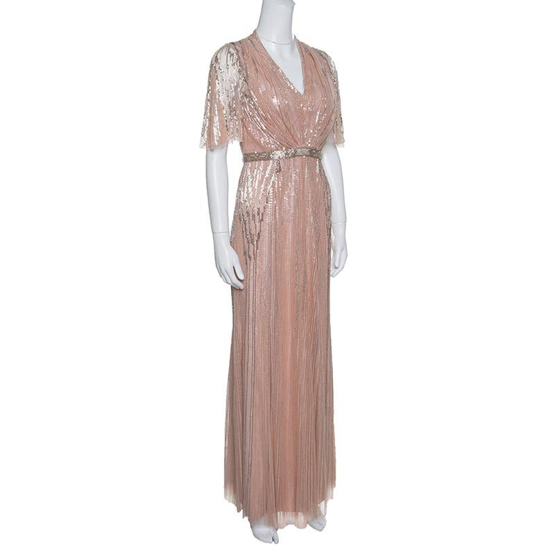 You'll shine brighter than the stars in this fabulous gown from Jenny Peckham. This blush pink tulle gown features exquisite sequins and stones embellished all over it and flaunts a V-neckline, short sleeves and a concealed zip closure at the back.