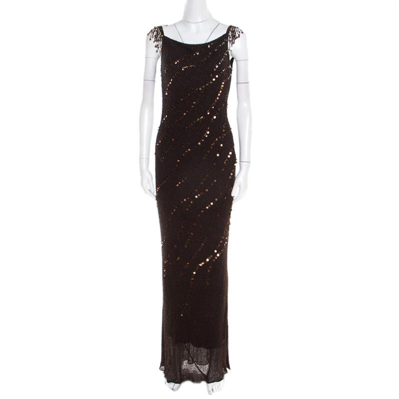 Add a touch of glam to your closet with this immensely gorgeous creation by Jenny Packham. Tailored with silk, the gown has beaded detailing all over and a zip closure to provide you with a comfortable fit. The sheer bottom hem highlights the