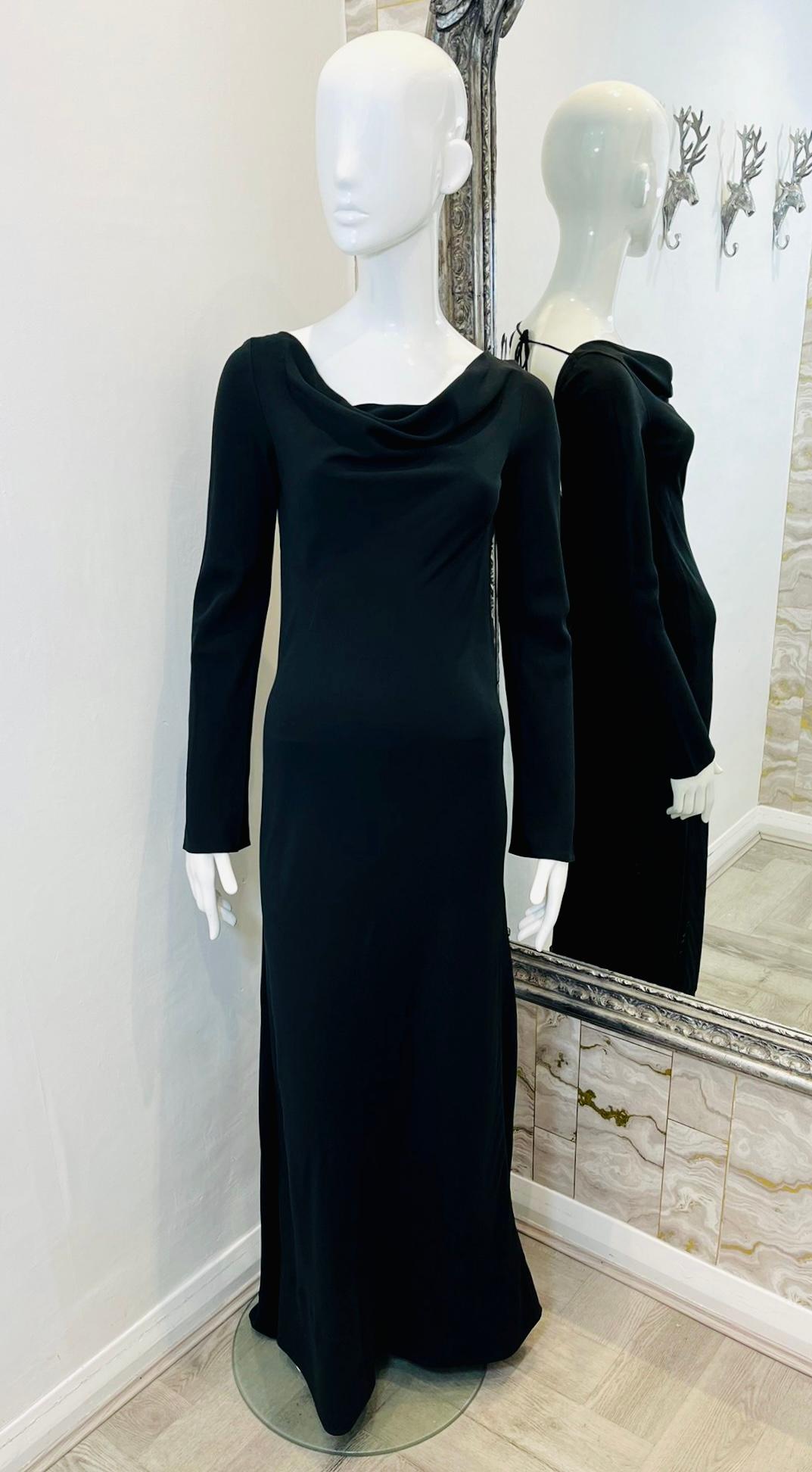 Jenny Packham Fishtail Gown

Black, evening dress designed with cowl neckline and long sleeves.

Styled with open back and tie-up detailing to rear.

Featuring bodycon silhouette and fishtail skirt.

Size – S (Label missing but