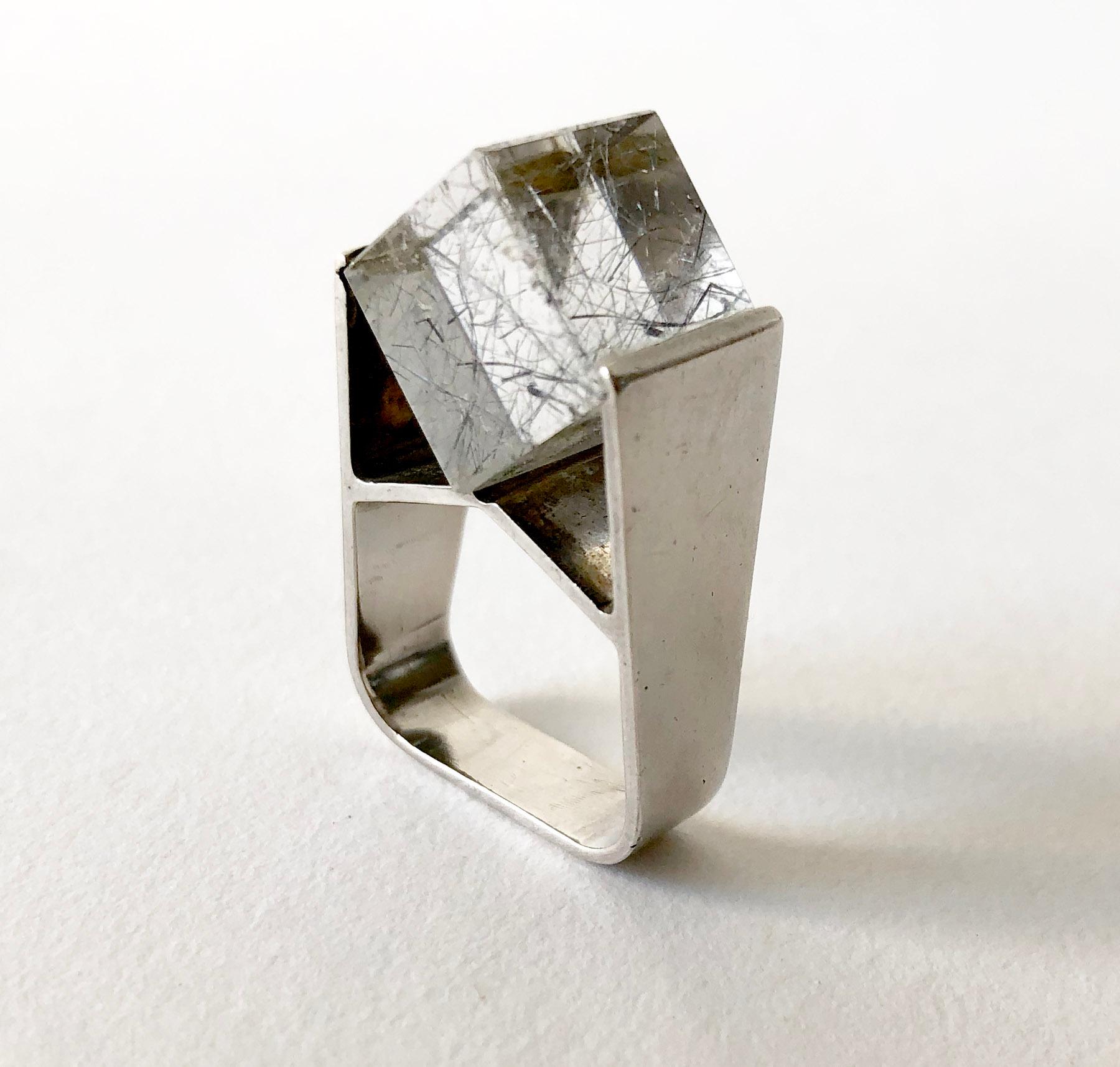 Tension set, rutilated quartz cube set created by Jens Christian Thejls of Denmark.  Ring is a finger size 5.75 to 6.25 and is signed Thejls, 925S, Denmark.  In very good vintage condition. 