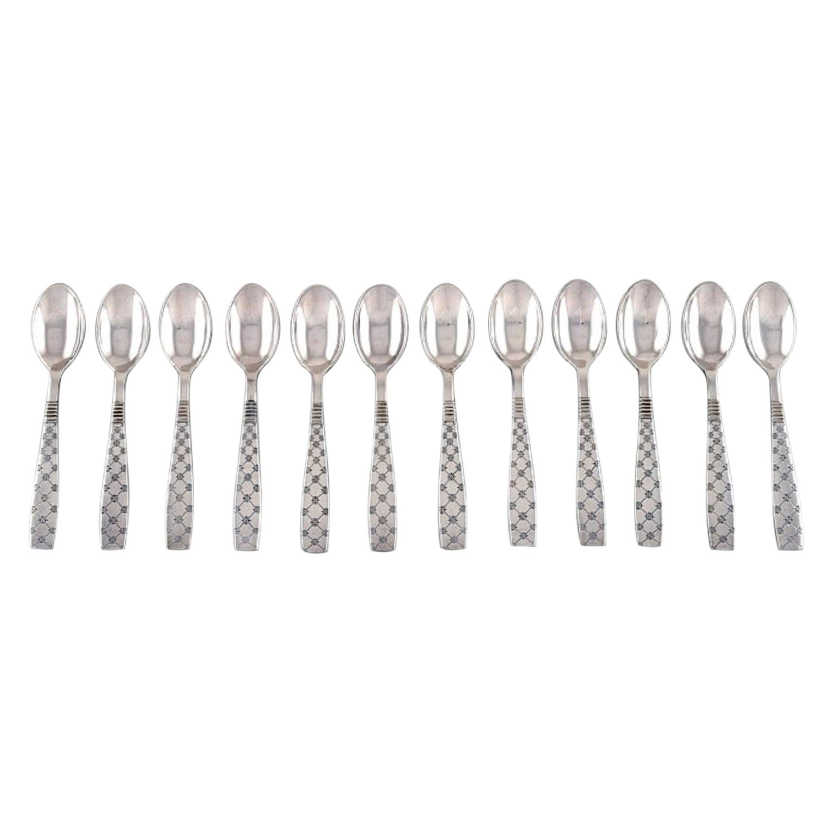 Jens H. Quistgaard, Denmark, 12 Star Teaspoons in Plated Silver For Sale