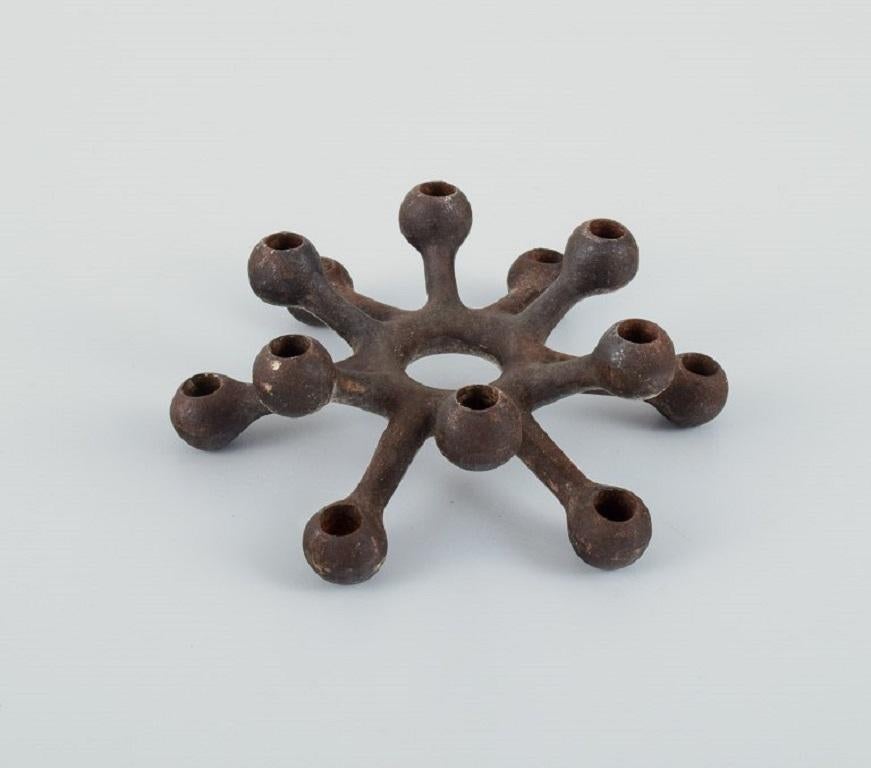 Danish Jens H. Quistgaard, Collection of Eleven Candlesticks in Cast Iron For Sale