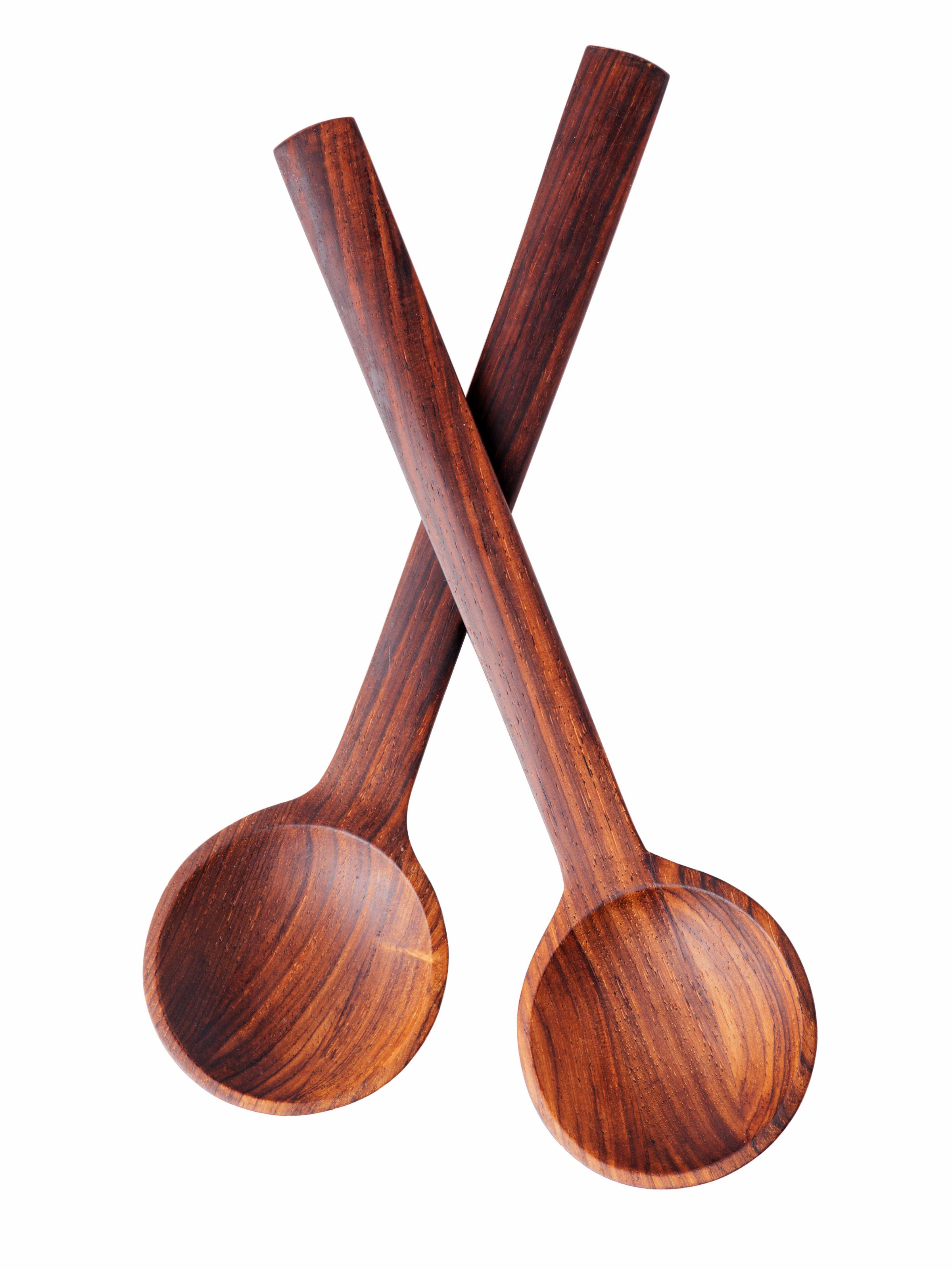 A scarce pair of Danish Modern serving spoons in solid rosewood designed by Jens Quistgaard (JHQ) for Dansk. Each signed 'Danmark'. 
