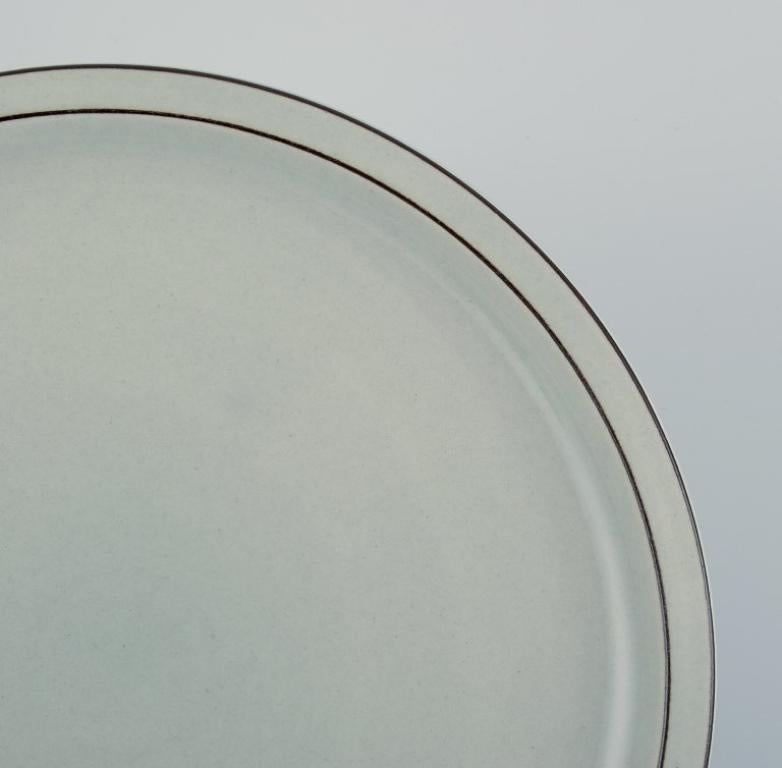 Jens Harald Quistgaard for Bing & Grøndahl, Colombia, round dish in stoneware.
Model number 624.
Approx. 1970.
First factory quality.
Perfect condition.
Marked.
Dimensions: D 26.0 x H 2.5 cm.