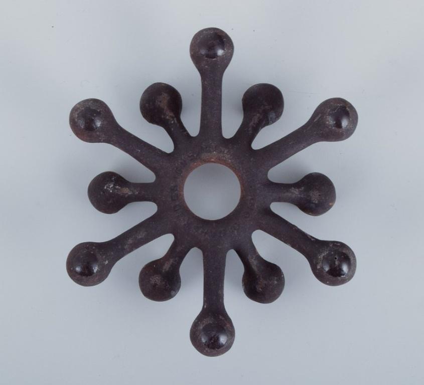 Jens Harald Quistgaard for Dansk Designs. Set of six candle holders in cast iron For Sale 1