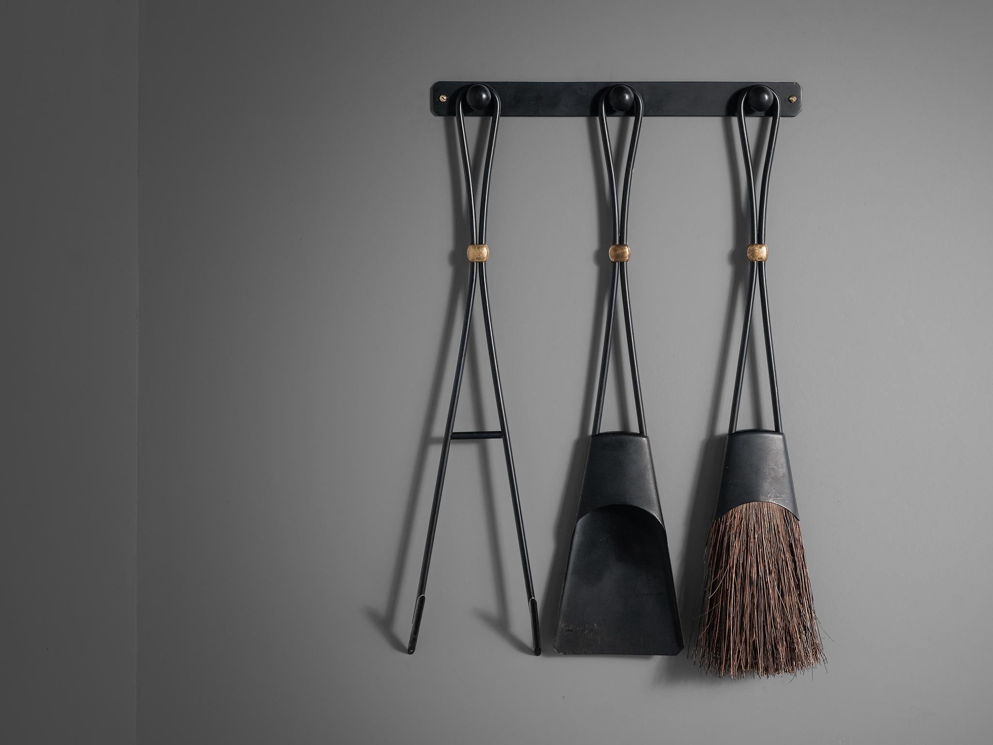 Jens H. Quistgaard, Dansk, fireplace tools, wrought iron and brass, circa 1965.

Rare set of wrought iron fireplace tools with brass accents by the Danish designer Jens H. Quistgaard. The set consist of three items, a shovel, poker, and brush on a