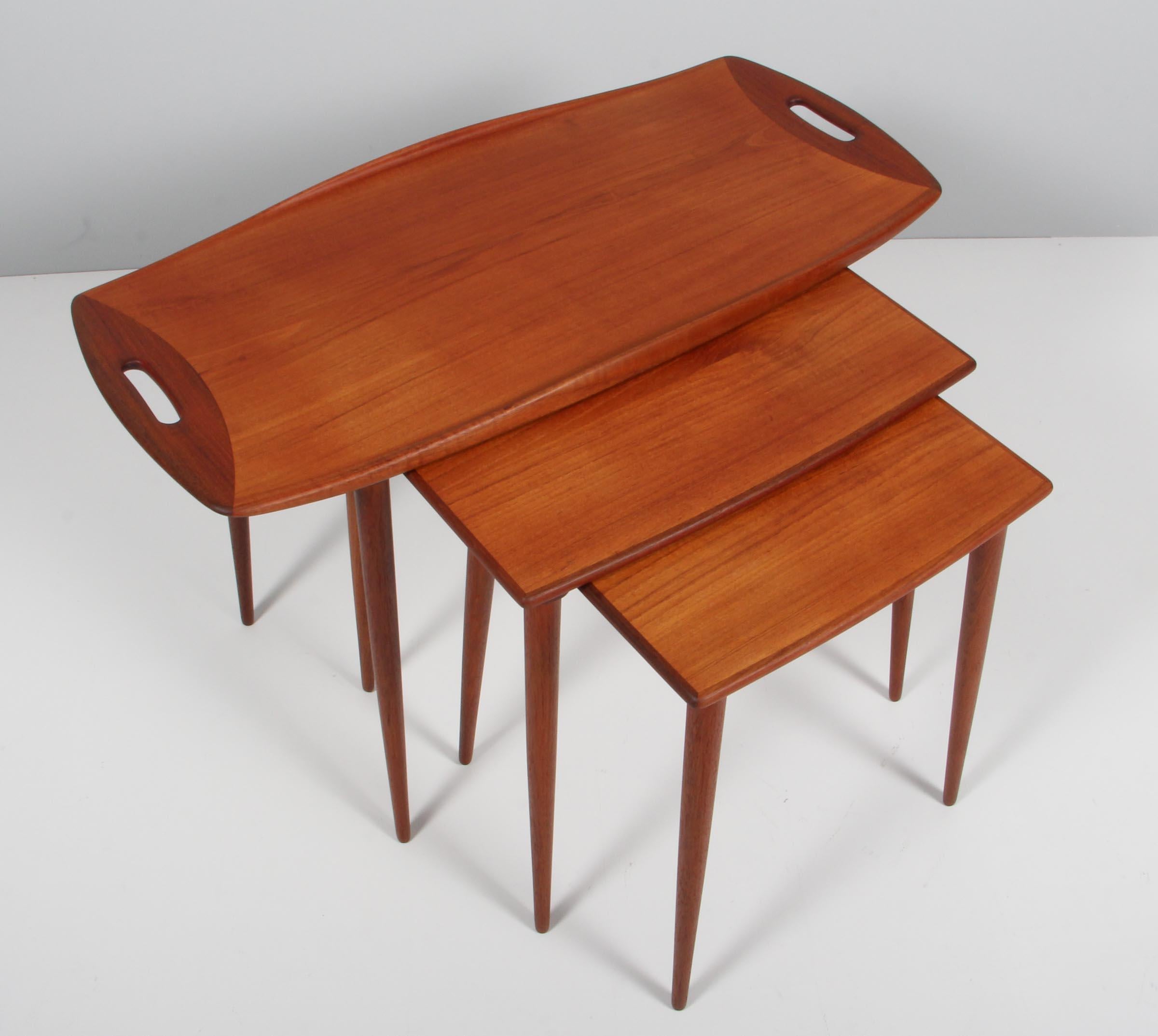Jens Harald Quistgaard set of three nesting tables in partly solid teak. With handles and curved edges. 

Made in the 1960s.