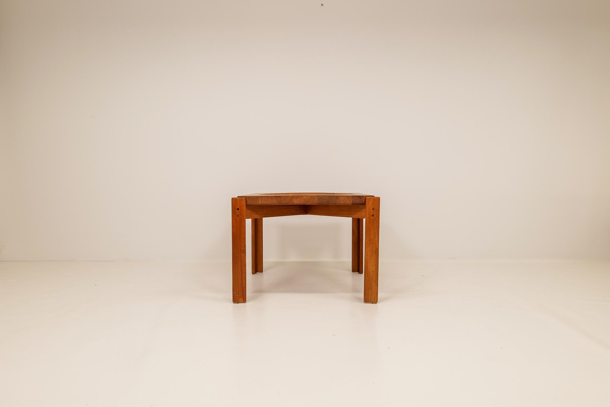 A typical Danish Mid-century design. This table is made of solid staves of teak laminated together; this gives the table a unique look. Jens Harald Quistgaard designed this tabled and this one was made in Sweden by Källemo, 
This tray table is