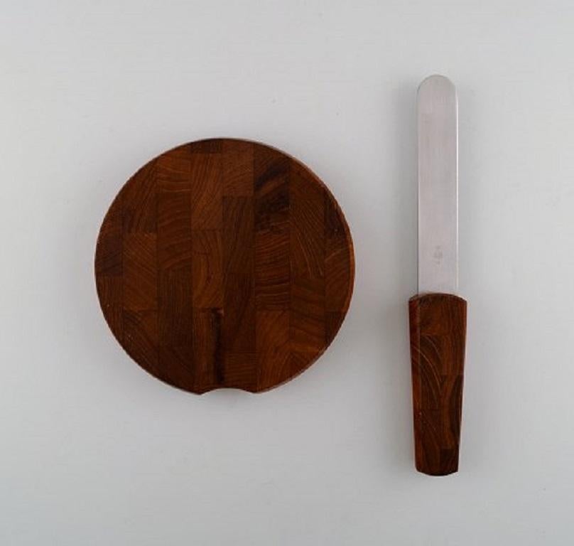 Danish Jens Harald Quistgaard. Teak wood cutting board with built-in knife. For Sale