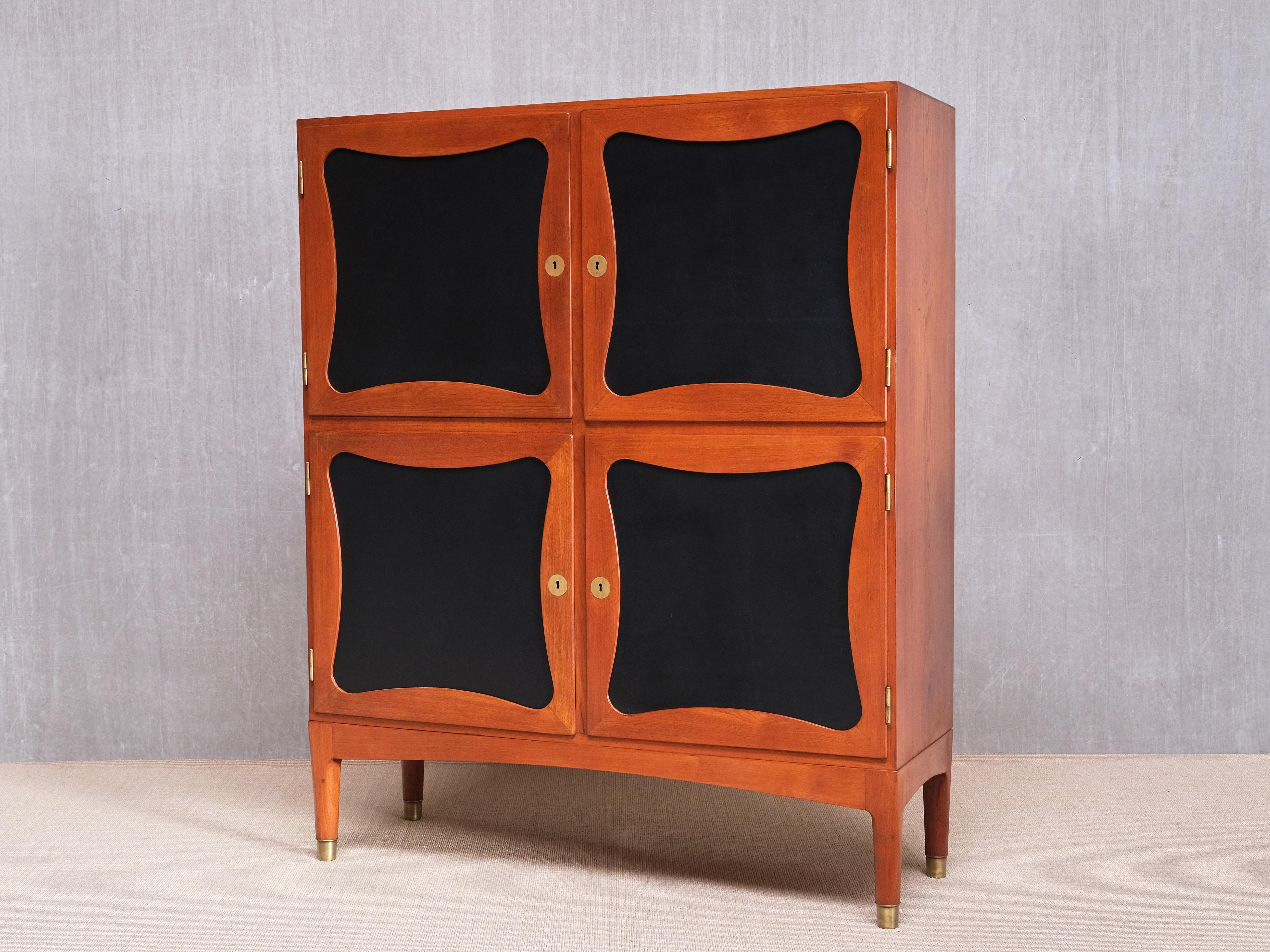 This exceptionally rare cabinet was designed and produced by the Danish cabinetmaker Jens Ingvard Jensen in the late 1940s. Jensen was one of the few Danish masters who established his workshop outside of Copenhagen, working in Odense, where he