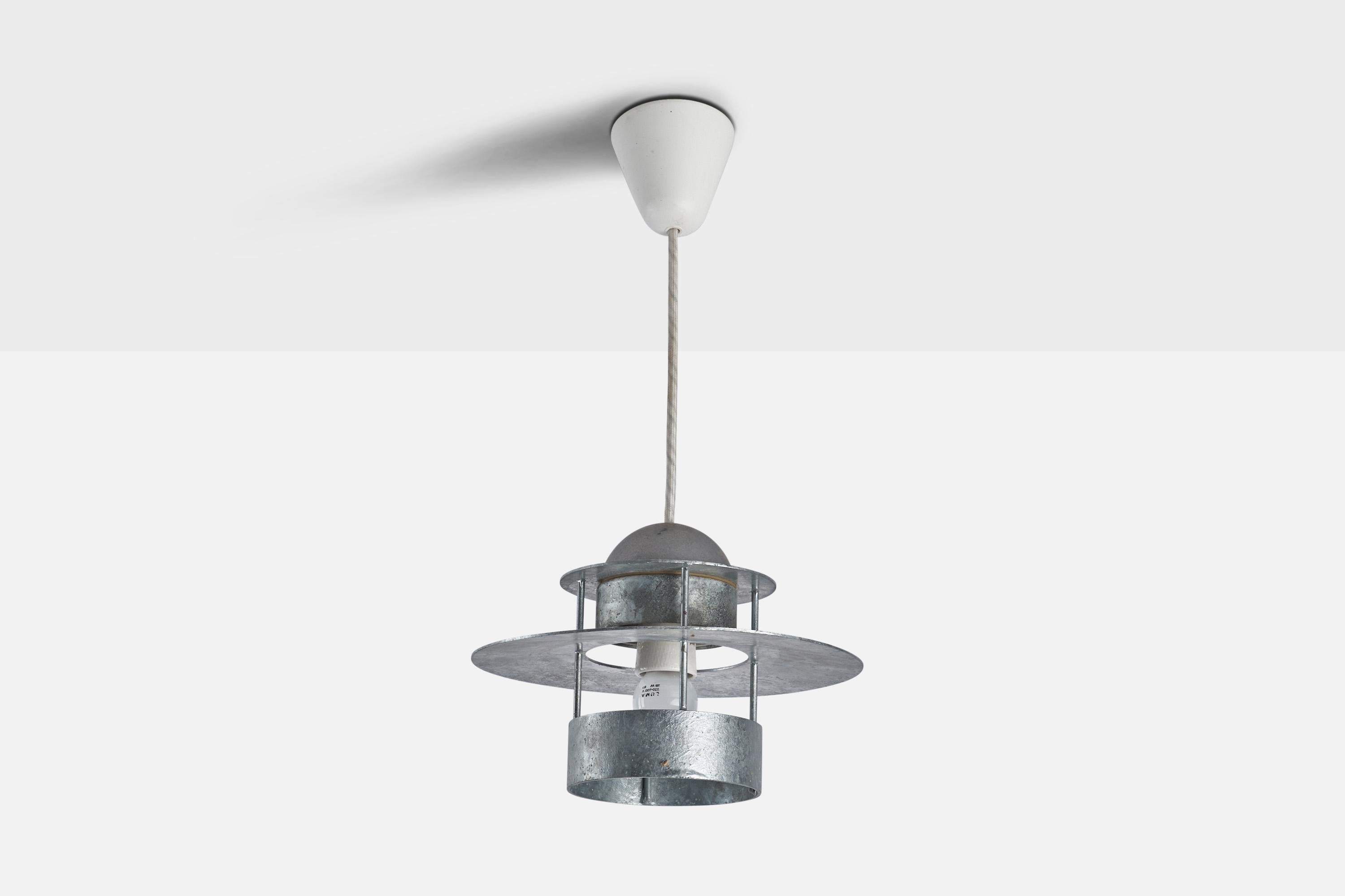 
A galvanised steel pendant light designed by Jens Møller-Jensen in 1963 and produced by Louis Poulsen, c. 1960s.
Dimensions of canopy (inches) : 3.22” H x 3.52” Diameter
Socket takes standard E-26 bulb. There is no maximum wattage stated on the