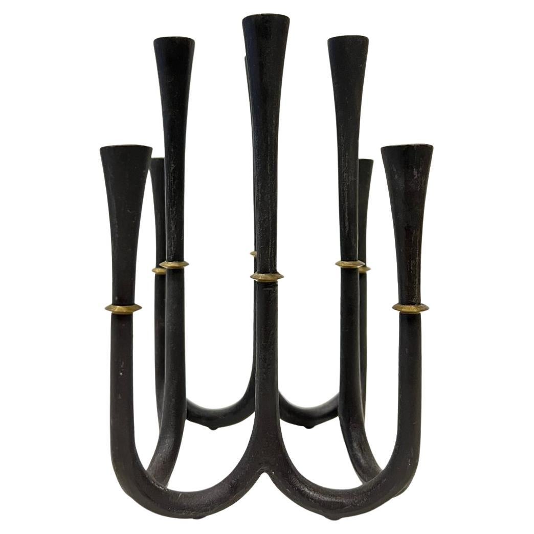 Jens Quistgaard candlestick, cast iron and brass, Denmark 1950s, good original condition.