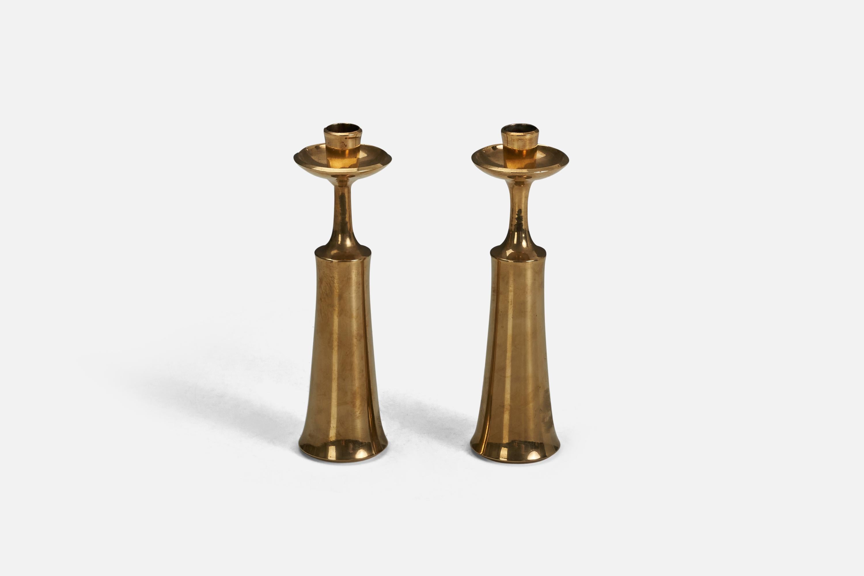 A pair of brass candlesticks designed and produced by Jens Quistgaard, Denmark, 1950s.