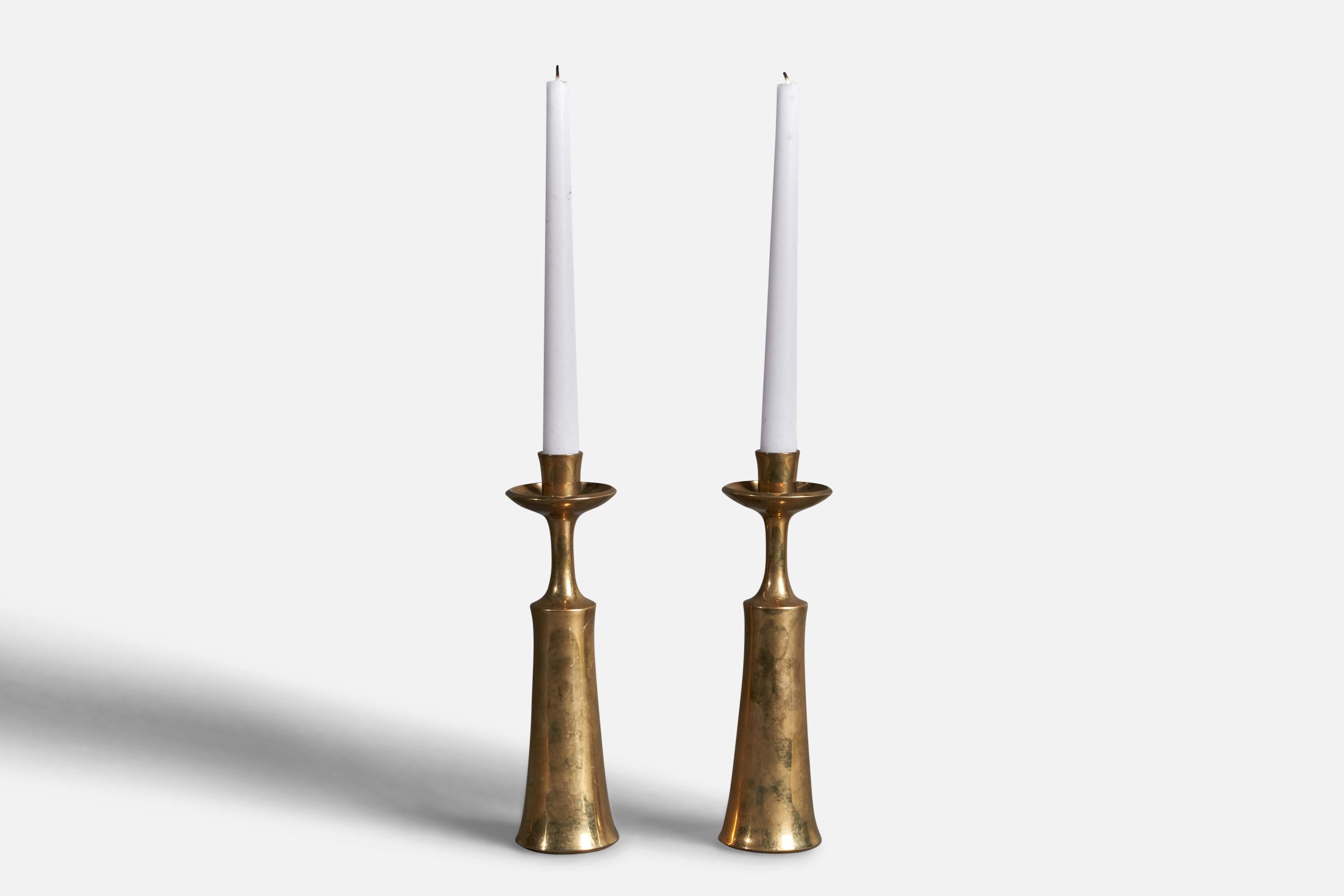 A pair of brass candlesticks designed by Jens Quistgaard and produced by Dansk Designs, Denmark, c. 1950s.
