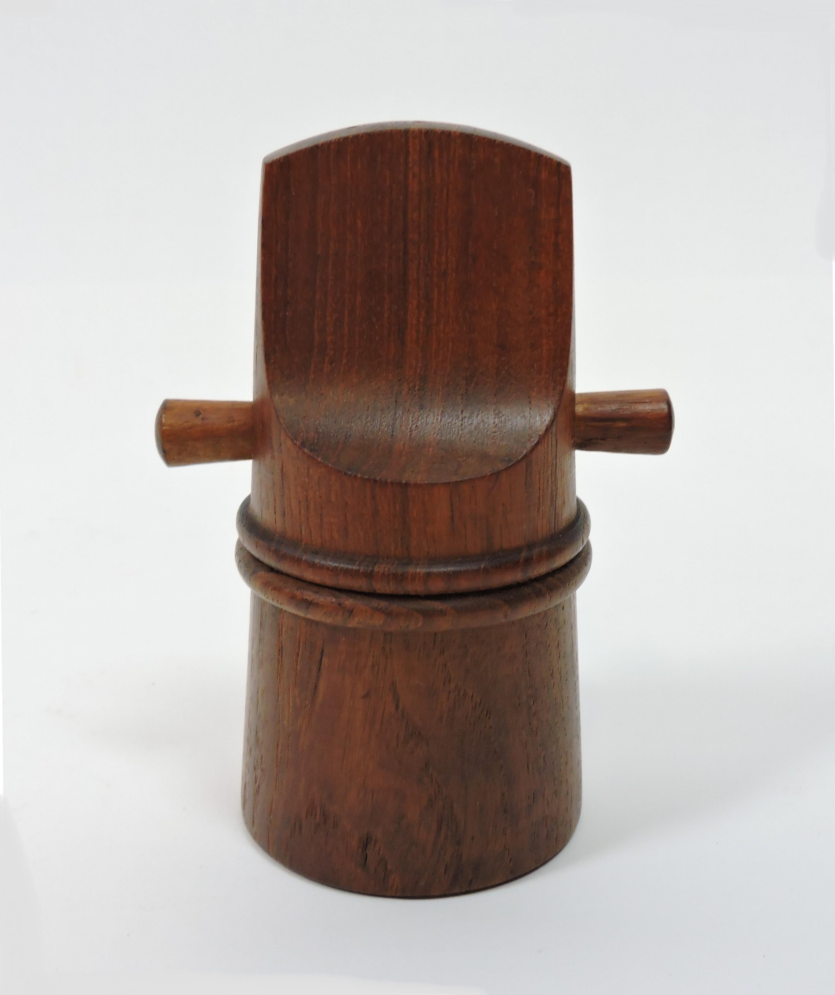 Dansk salt shaker/peppermill combo, model #834, designed by Jens Quistgaard and made by Dansk. This mill is made of teak and has two plugs in the top that can be removed for filling with salt, and turning the bottom lines up the opening for filling