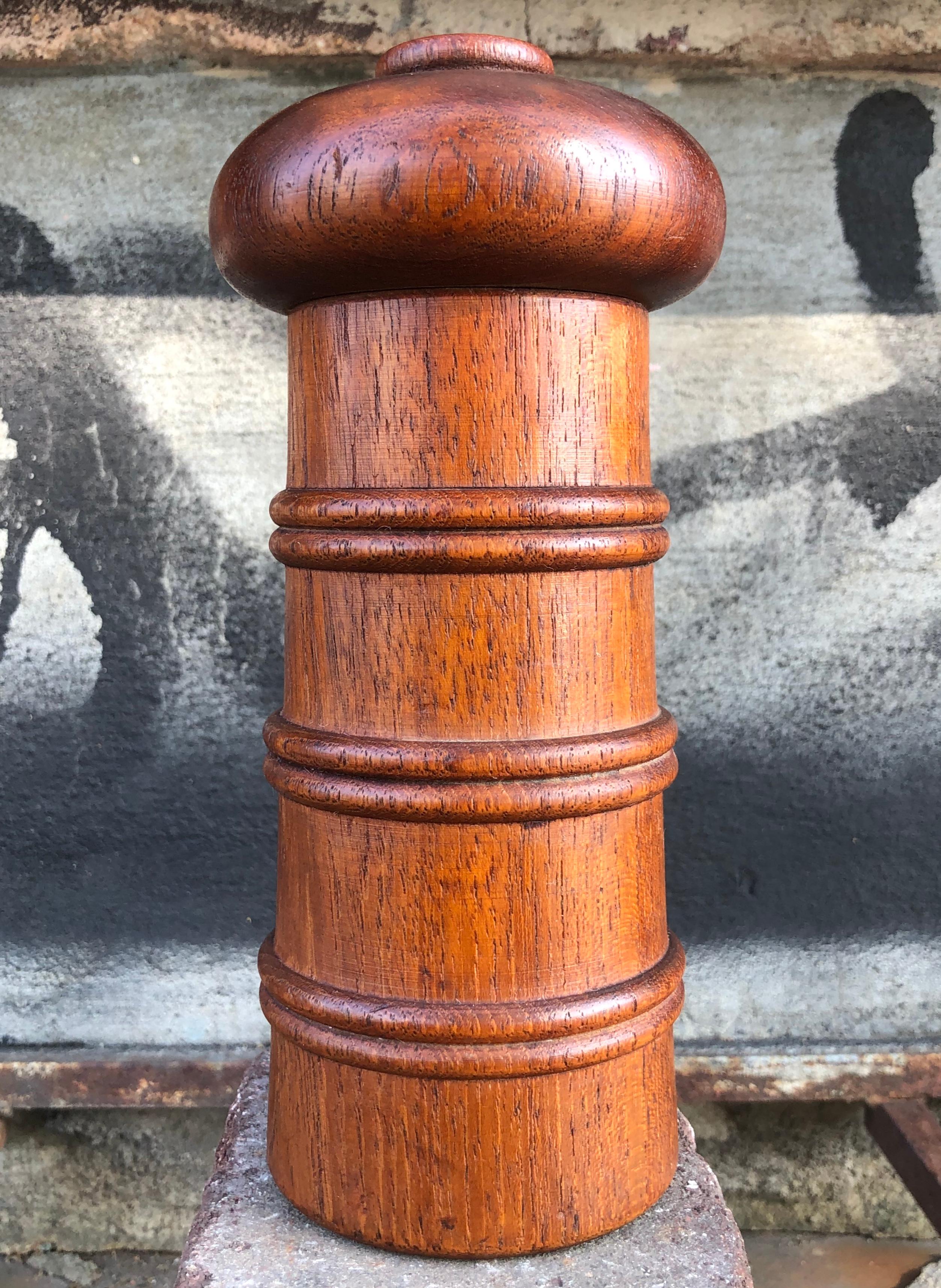Gorgeous early teak pepper tinder/mill designed by Jens Quistgaard and produced by Dansk of Denmark. Signed to underside. The gorgeous teak has been freshly oiled and is radiant. The patina is superb and the sculptural lines make it as pleasing to