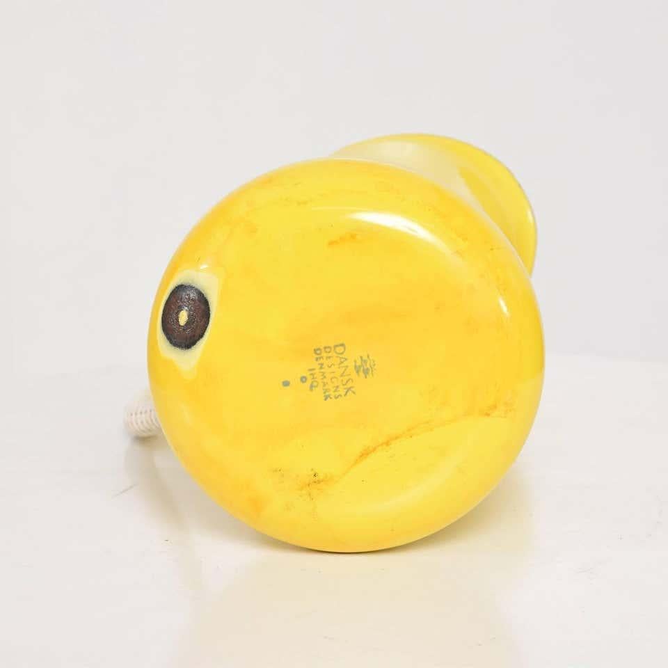 By Danish designer Jens Quistgaard for Dansk Pitcher in bright yellow enamel metal with white interior has plastic covered handles woven rattan style.
A Dansk Designs Denmark IHQ piece Mid-Century Modern 1960s stamped by maker.
Dimensions: 9 1/2