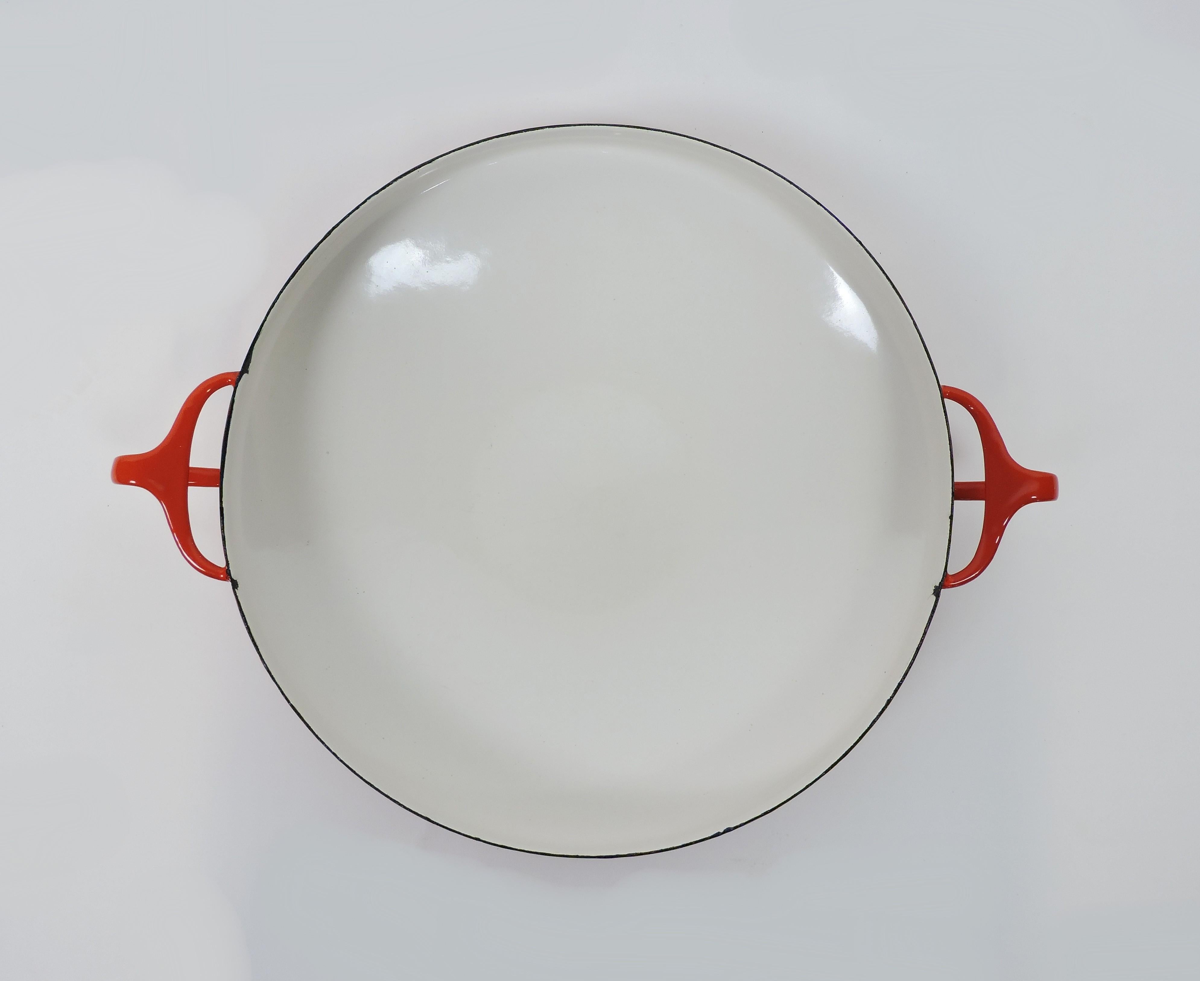 Beautiful Dansk Kobenstyle bright red and white enamel on steel large size paella pan designed by Jens Quistgaard and made in Denmark by Dansk. Kobenstyle cookware was introduced in 1955, and the logo on the bottom dates this pan to the