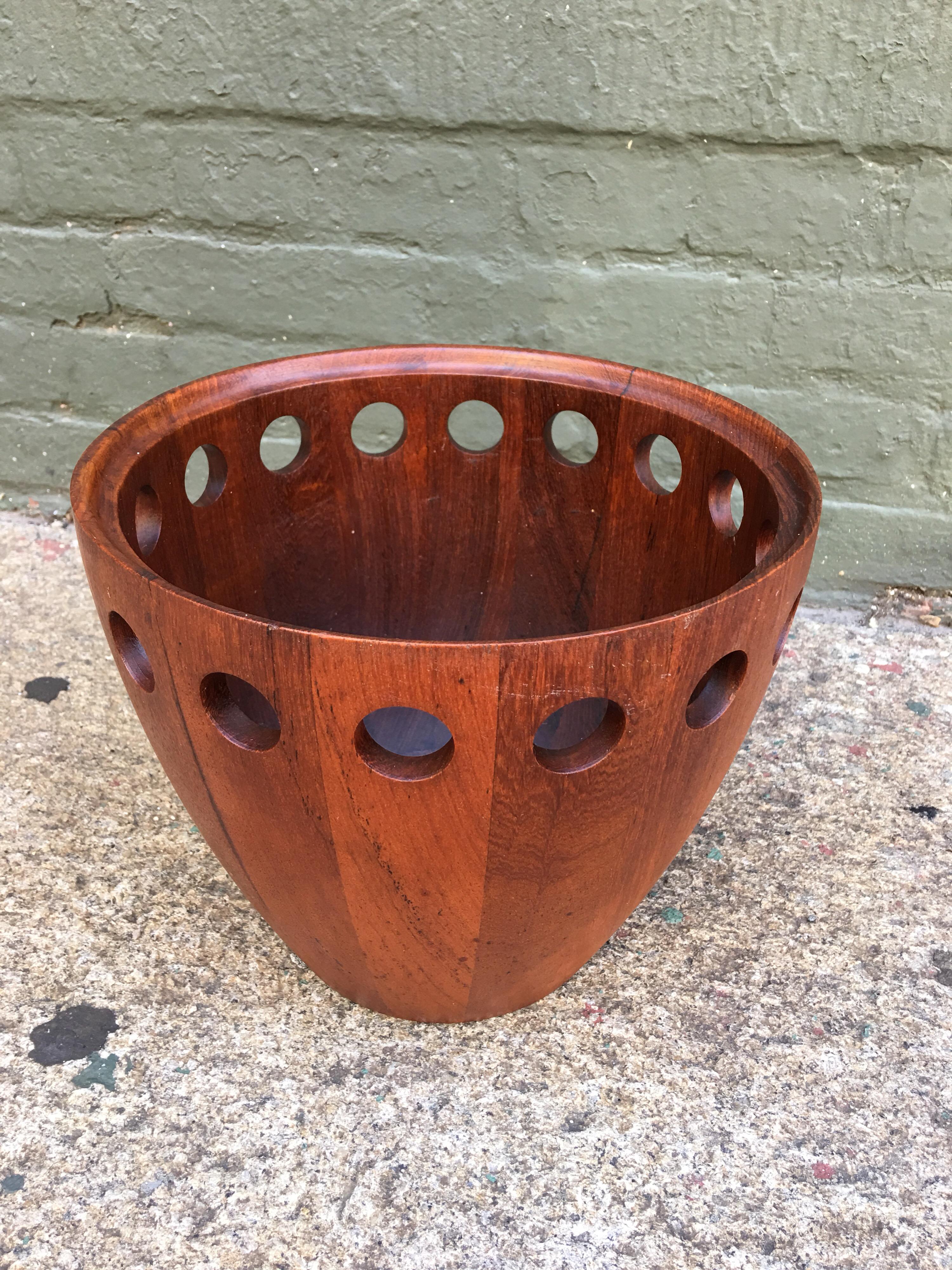Jens Quistgaard for Dansk fruit bowl in staved teak. Unusual Form with round holes drilled towards top of bowl. Signed on bottom, bowl dated to the mid-1950s.