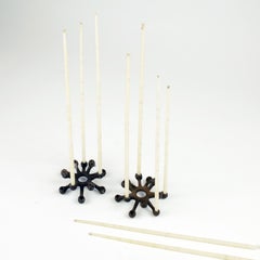 Jens Quistgaard for Dansk, Pair of Cast Iron Candleholders and Candles, 1960s