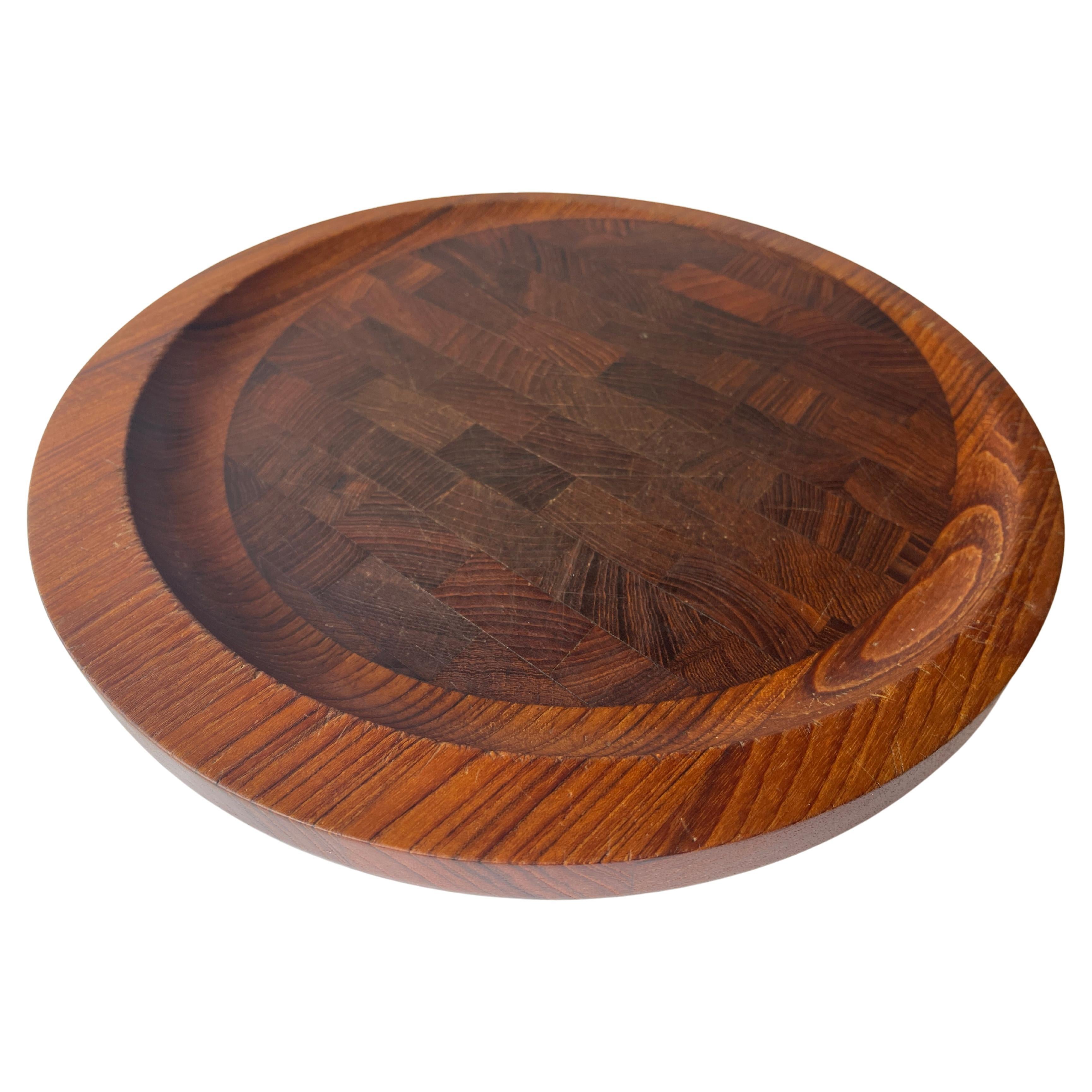 Dansk exotic teak and wenge wood round serving tray with beautiful counterbalanced design. Hand made by renowned Danish designer,
 Jens Quistgaard, in Denmark. Engraved hallmark on bottom of tray.