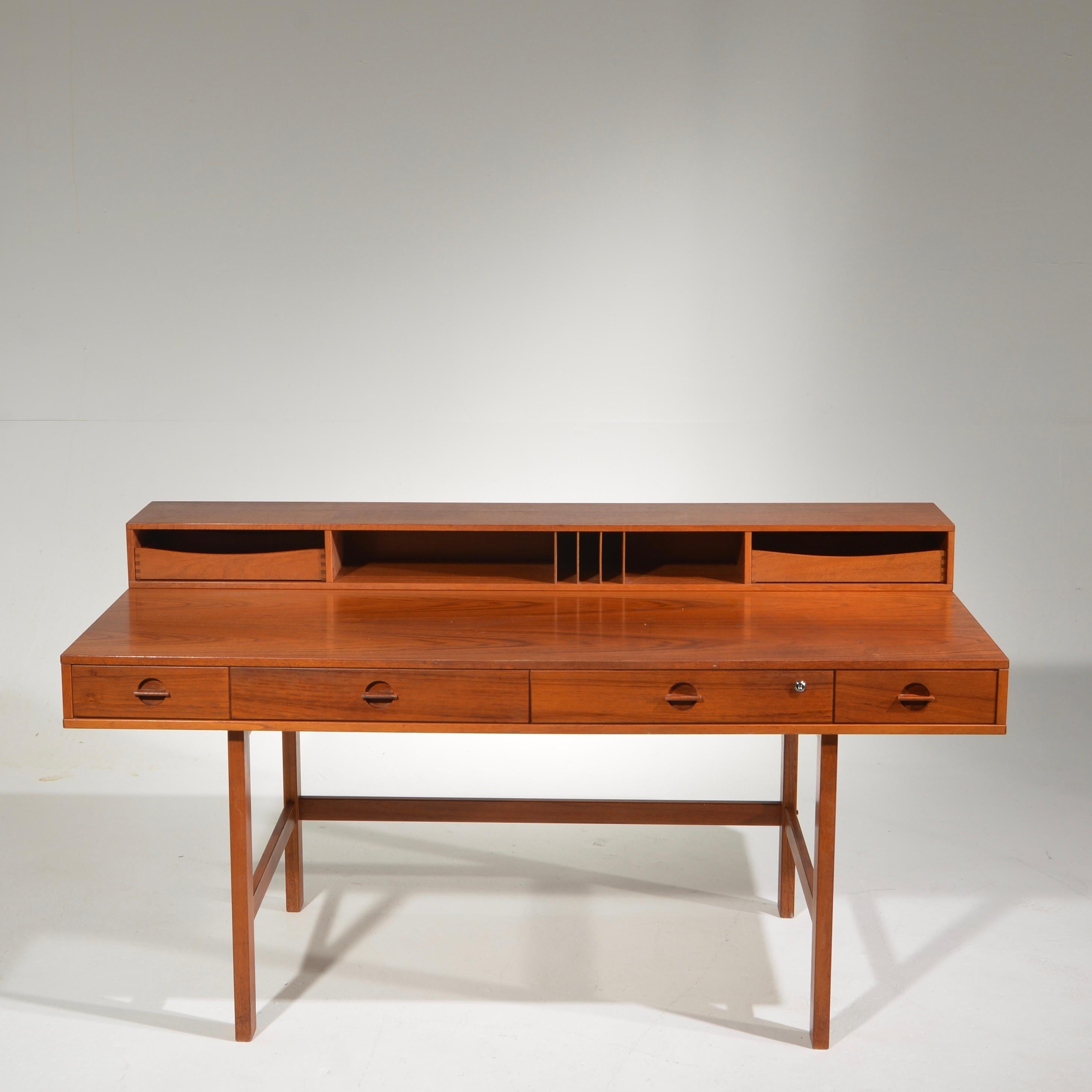An expansive and expandable Danish modern teak executive partners desk designed by Jens Quistgaard of Dansk for Peter Løvig Nielsen.
This piece is viewable at our Downtown LA warehouse. All of our item carry a 2 year warranty, see store policies