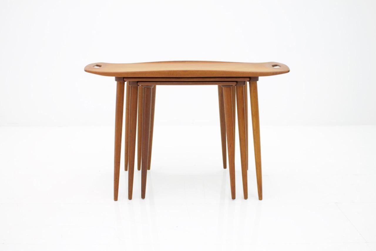 Set of three nesting tables in teak wood by Jens Quistgaard. 
Beautiful details, very good condition.