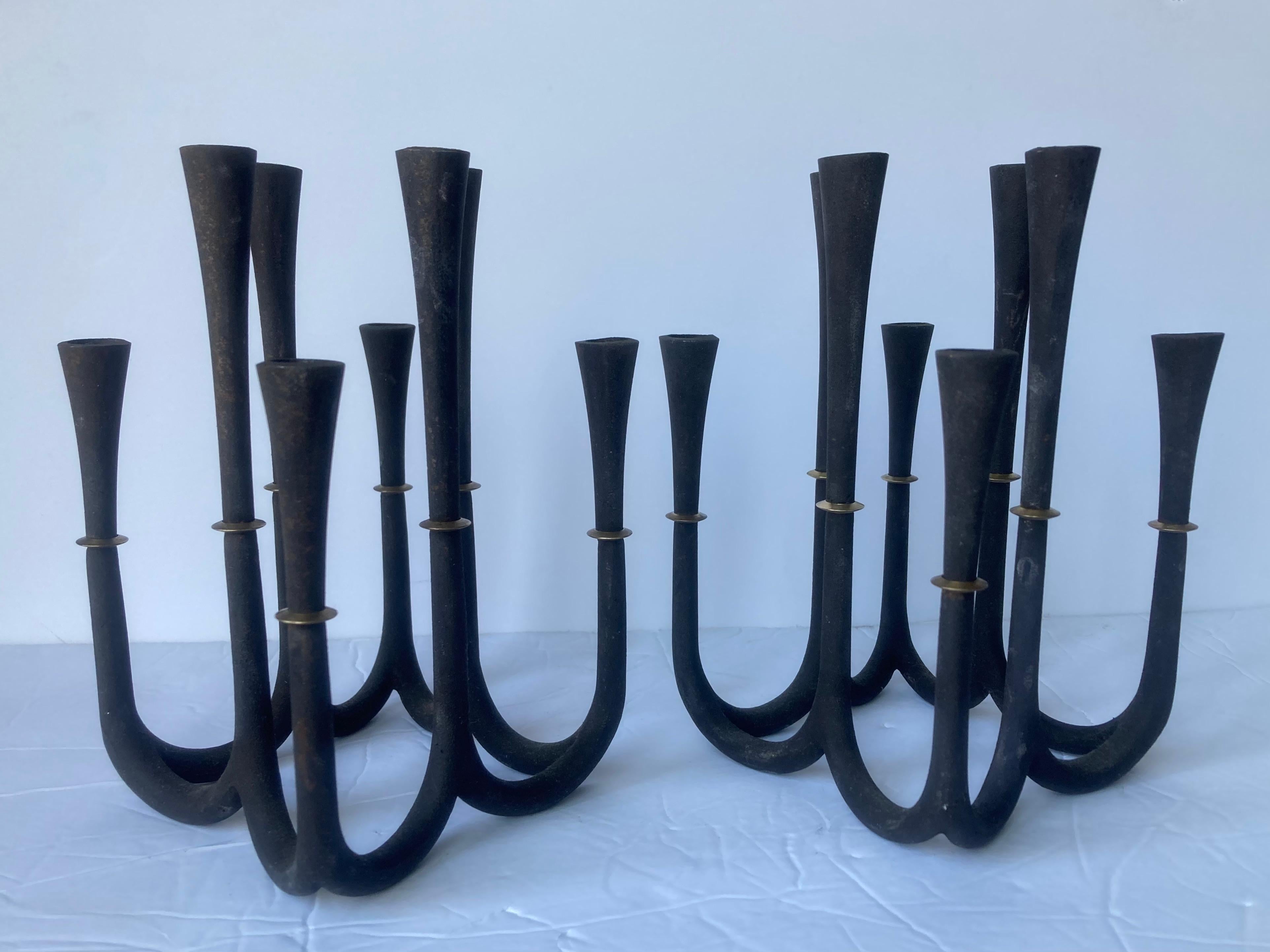Great design in this pair of cast iron  candlesticks by Jens Quistgaard , by Dansk, marked JHQ plus Denmark .