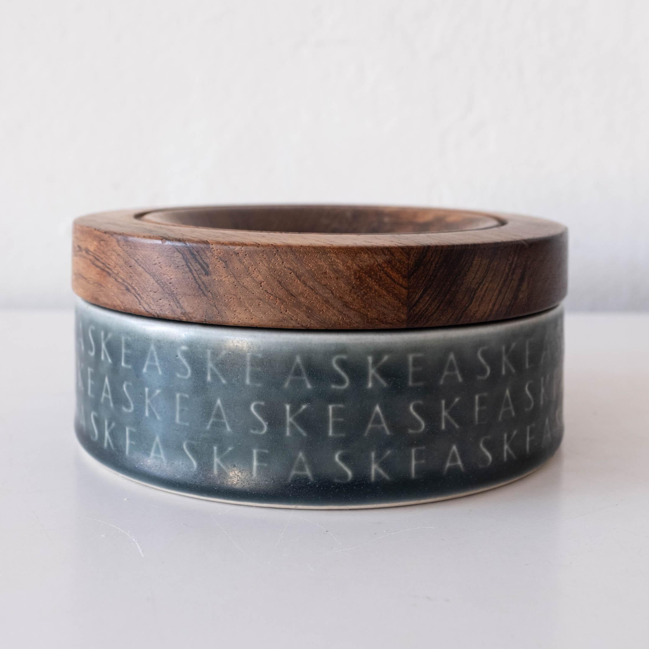 Jens Quistgaard designed ceramic ashtray with removable rosewood lid. 
From his collection for Kronjyden Nissen. Denmark, 1960s