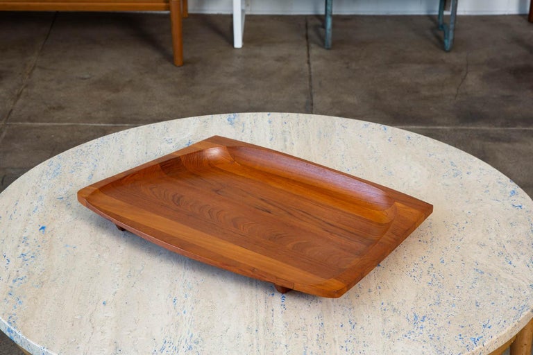 Dansk is one of the most beloved and celebrated makers of midcentury table and kitchenware; whether its their use of teak or enamel, their designs endure even 60 years later, making their pieces highly sought after and collectible. This tray was
