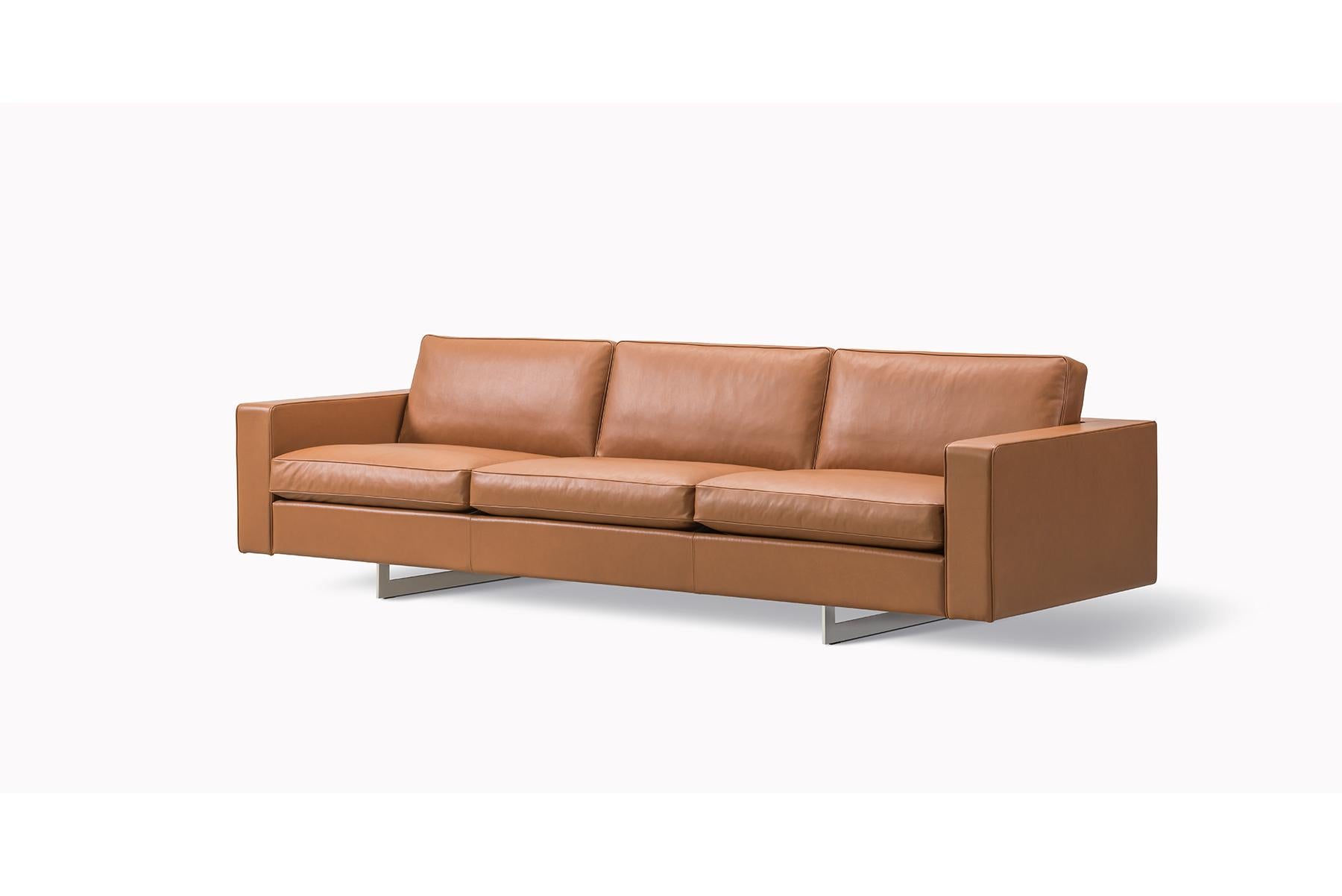 Risom 65 sofa – 3 seater – metal base originally designed by Jens Risom in 1961 the A-chair is a graceful expression of an elegant, upholstered chair in a timeless design, boasting an A-frame in the back for added support and as signature detail.