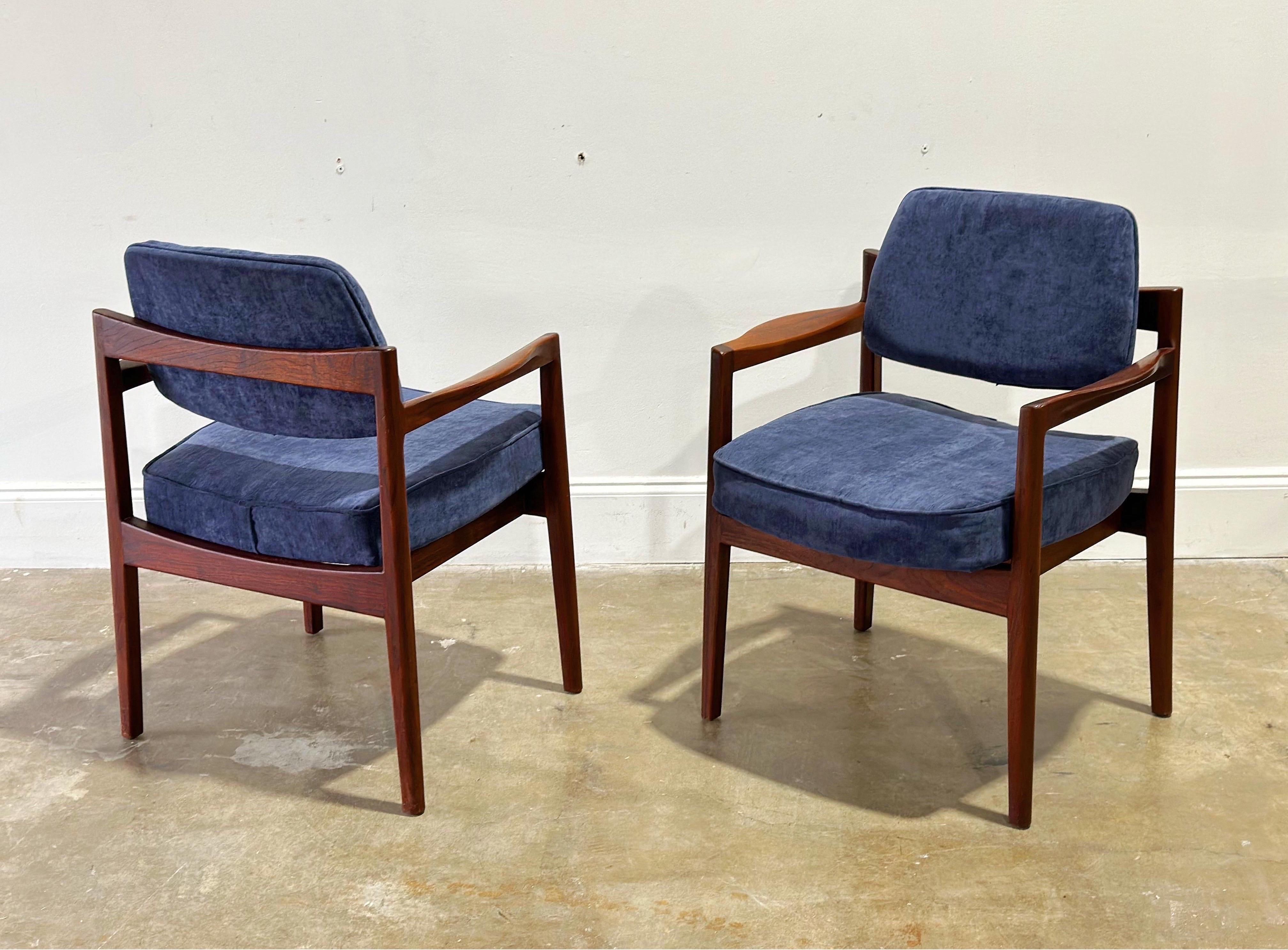 Jens Risom upholstered armchairs in sculpted solid black walnut - set of four, circa early 1960s. Refined, elegant Danish modern design coupled with stout and sturdy American craftsmanship.

This listing is for a set of four (4) arm