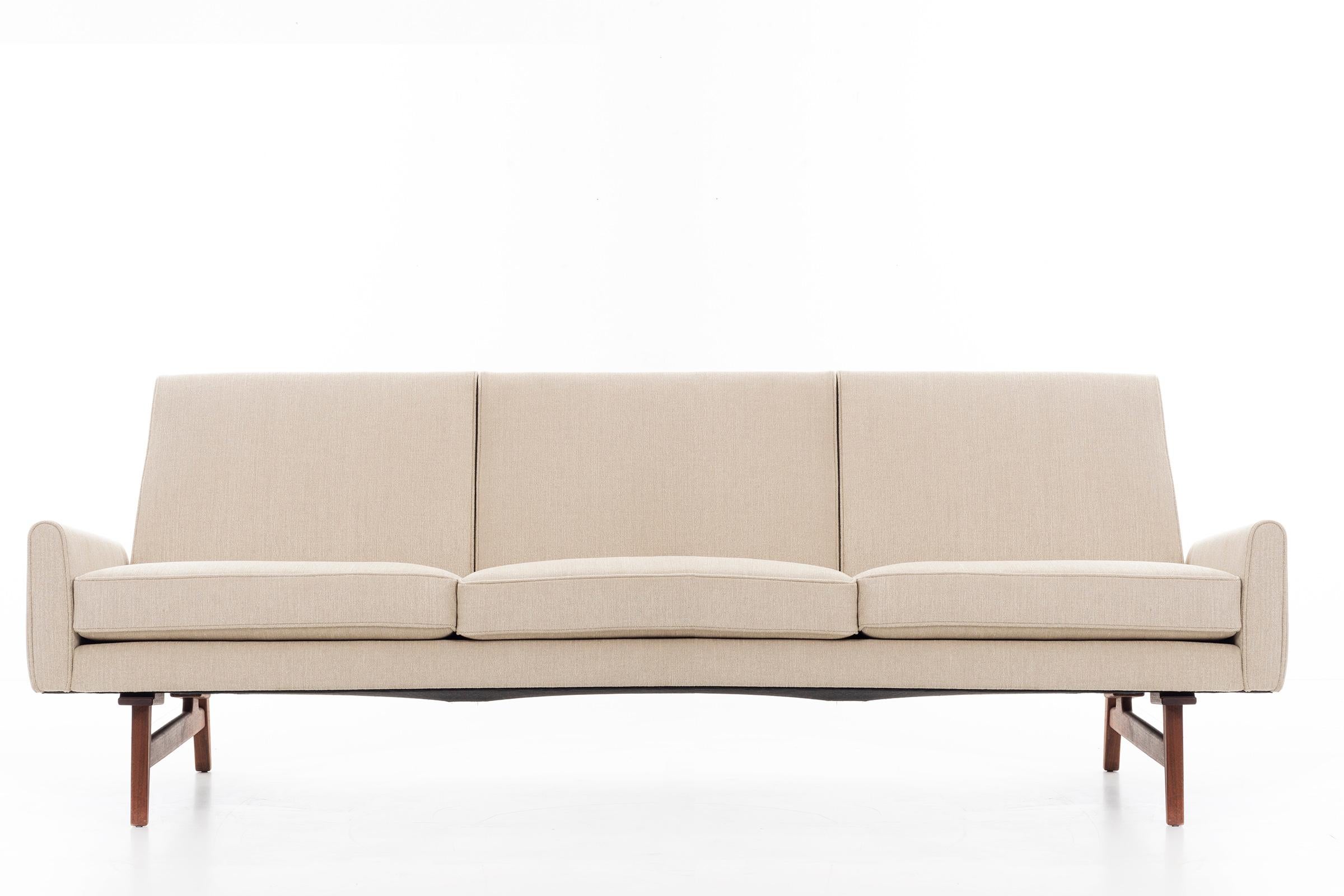Risom for Risom Inc. three seat sofa; Solid oiled-walnut base holds sofa frame securely, rebuilt completely and reupholstered with great plains cotton-poly blend.
 