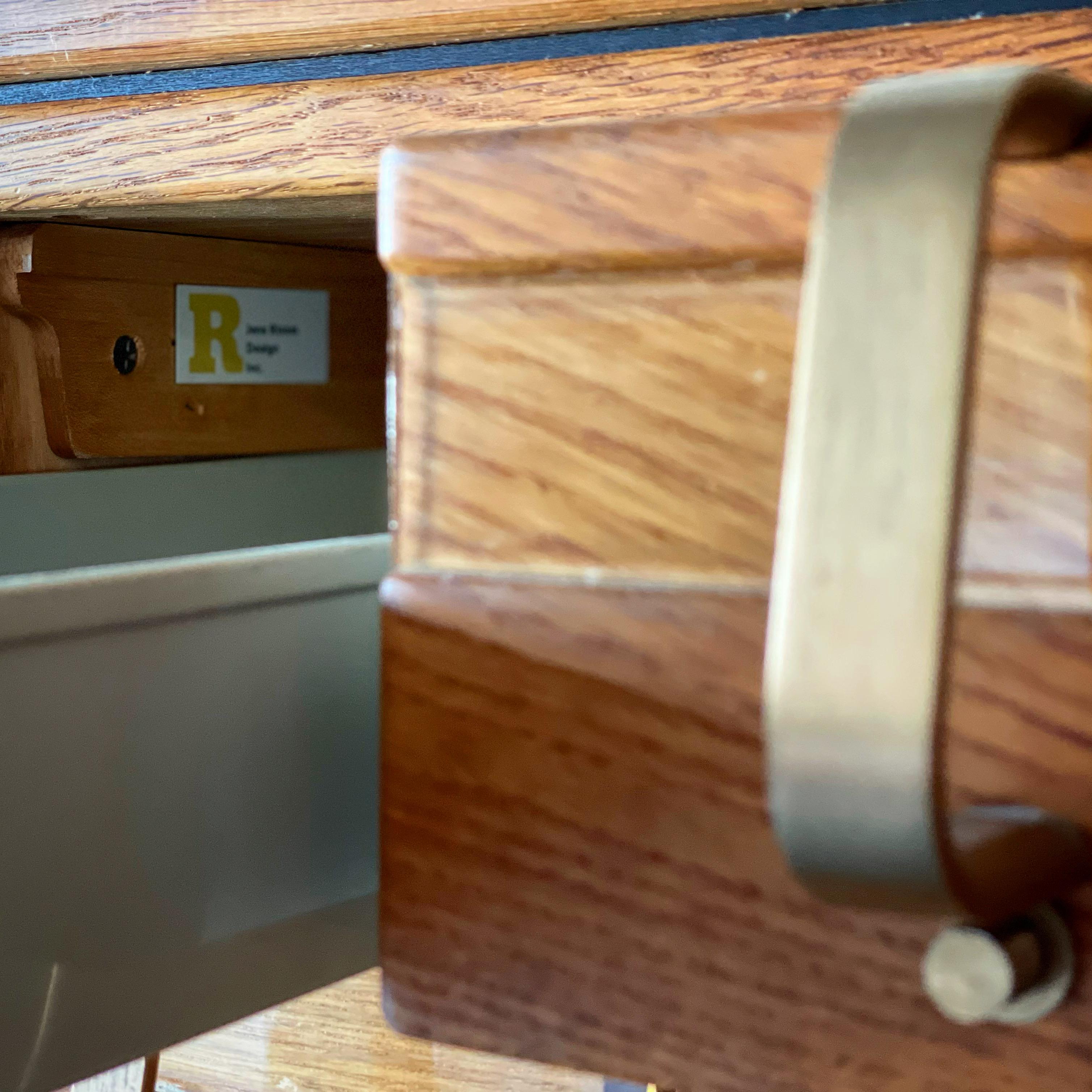 Rare Mid-Century Modern library card catalog in quarter sawn oak and solid brass by Jens Risom. Unique on the market - truly a collectors piece. 60 drawers, each one embossed with the Risom logo. Stunning 3/4