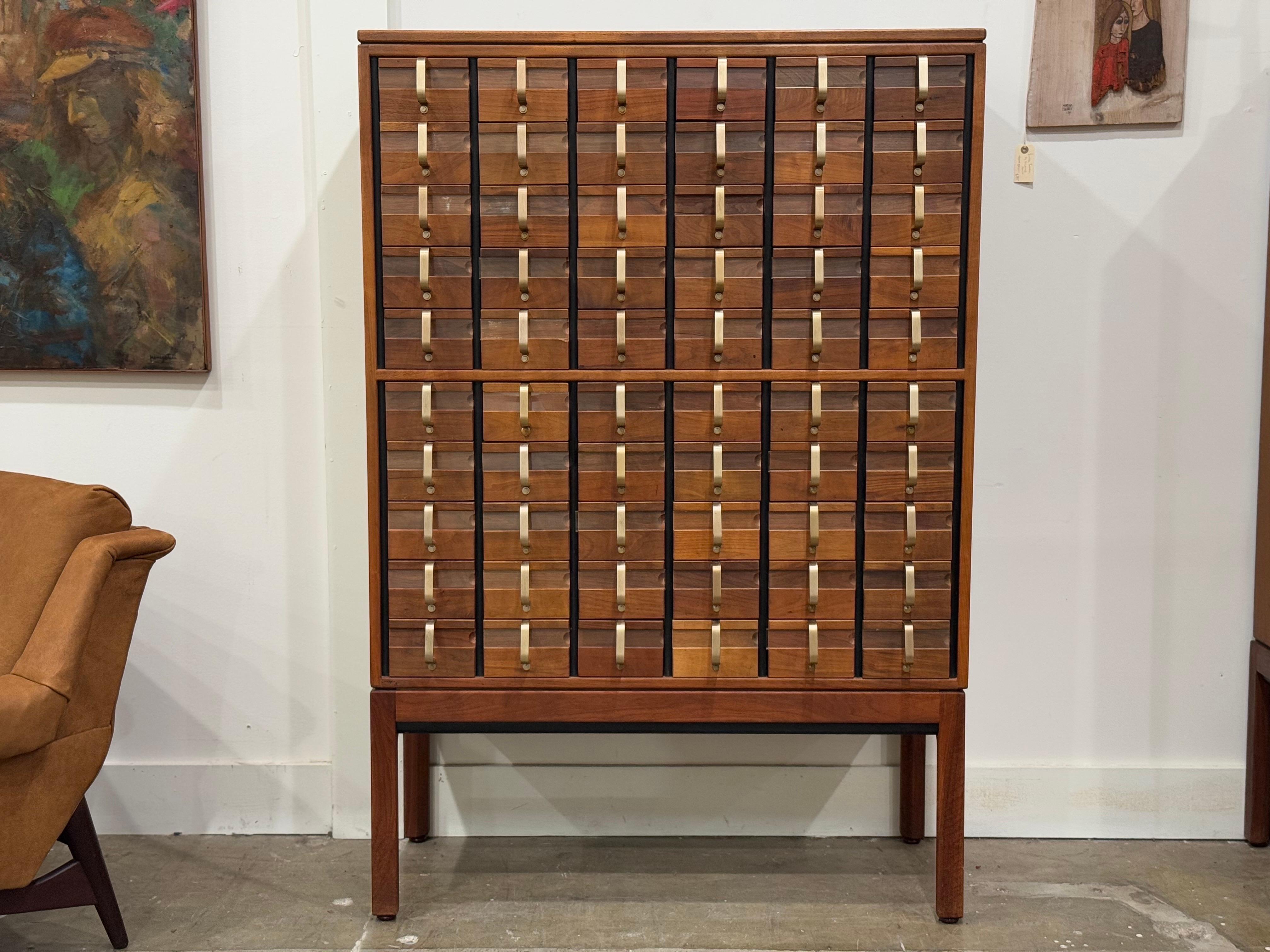 Rare Mid-Century Modern library card catalog in black walnut and solid brass by Jens Risom. Truly a collectors piece. 60 drawers. Stunning 3/4