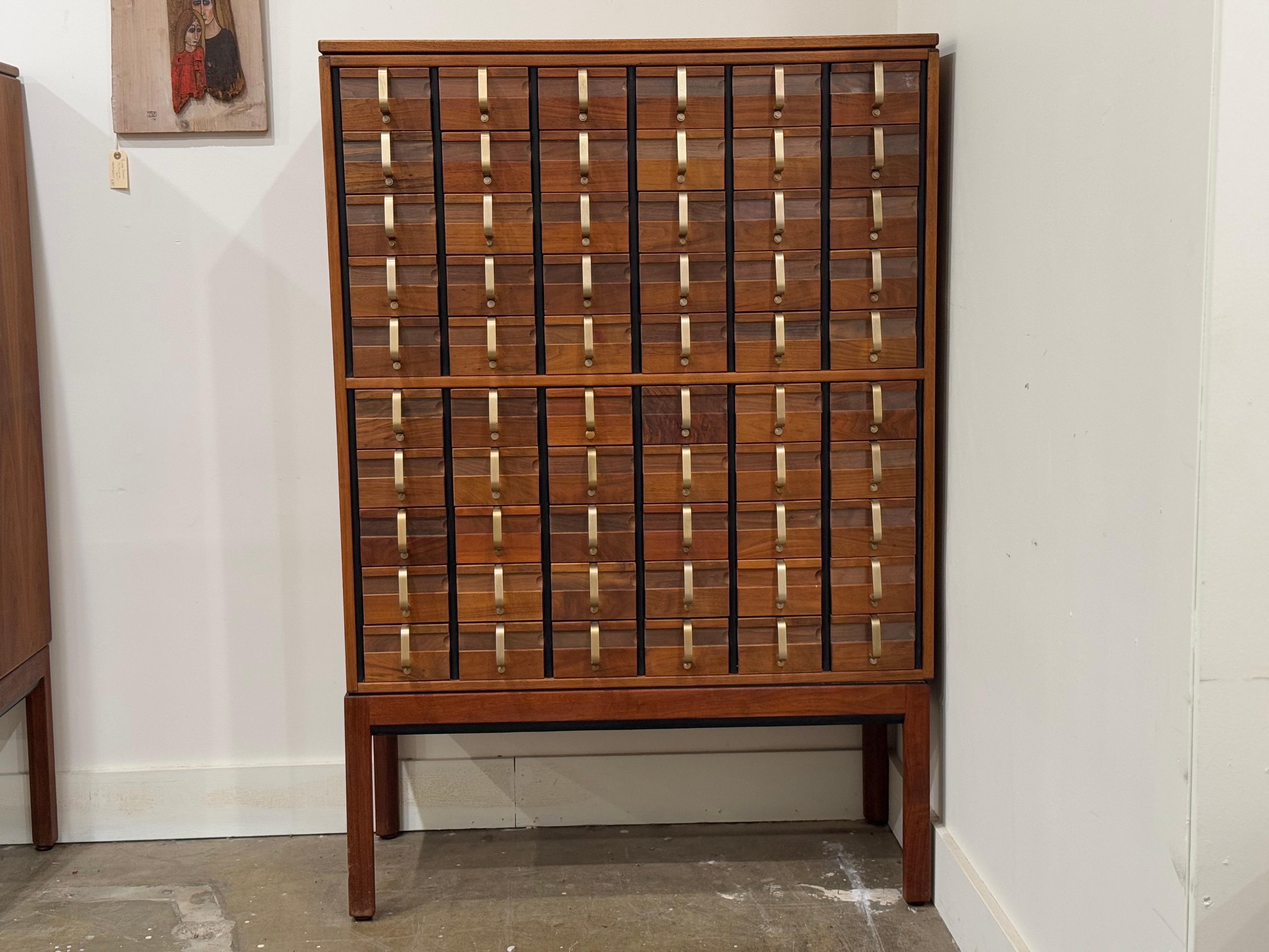 Rare Mid-Century Modern library card catalog in black walnut and solid brass by Jens Risom. Truly a collectors piece. 60 drawers. Risom Labels present. Stunning 3/4