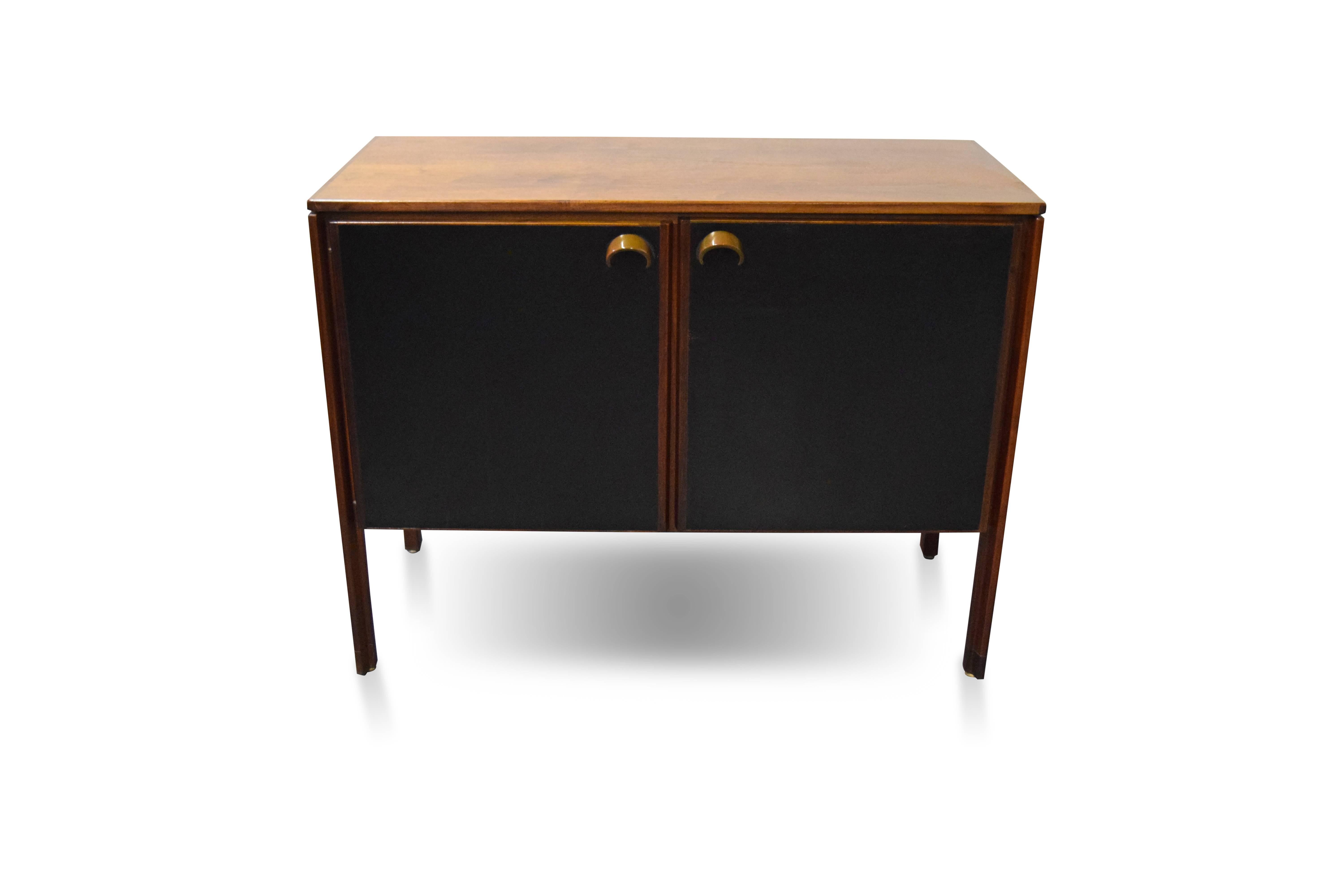 Jens Risom compact credenza 

Interior shelves are adjustable.